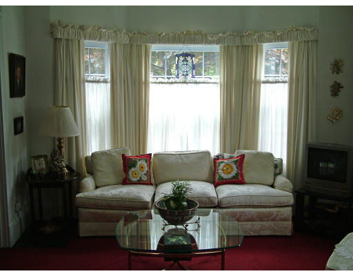 66 Garfield Street Springfield, MA 01108 - Photo 5 of 12 a living room with furniture and a window