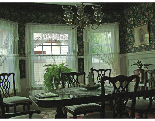 66 Garfield Street Springfield, MA 01108 - Photo 6 of 12 a living room with fireplace furniture and a potted plant
