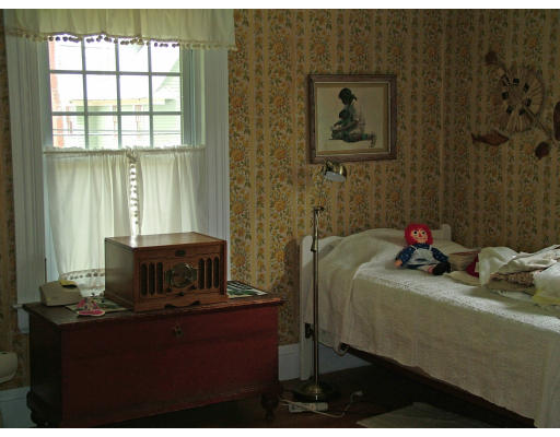 66 Garfield Street Springfield, MA 01108 - Photo 9 of 12 a bedroom with a bed and a window