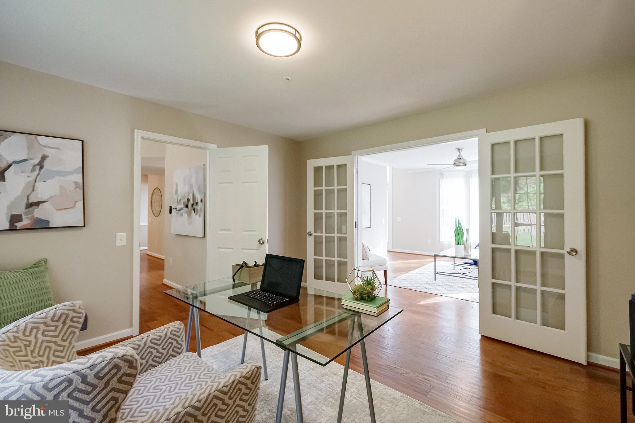 7428 Quail Ridge Lane Bowie, MD 20720 - Photo 11 of 87 a living room with furniture and wooden floor