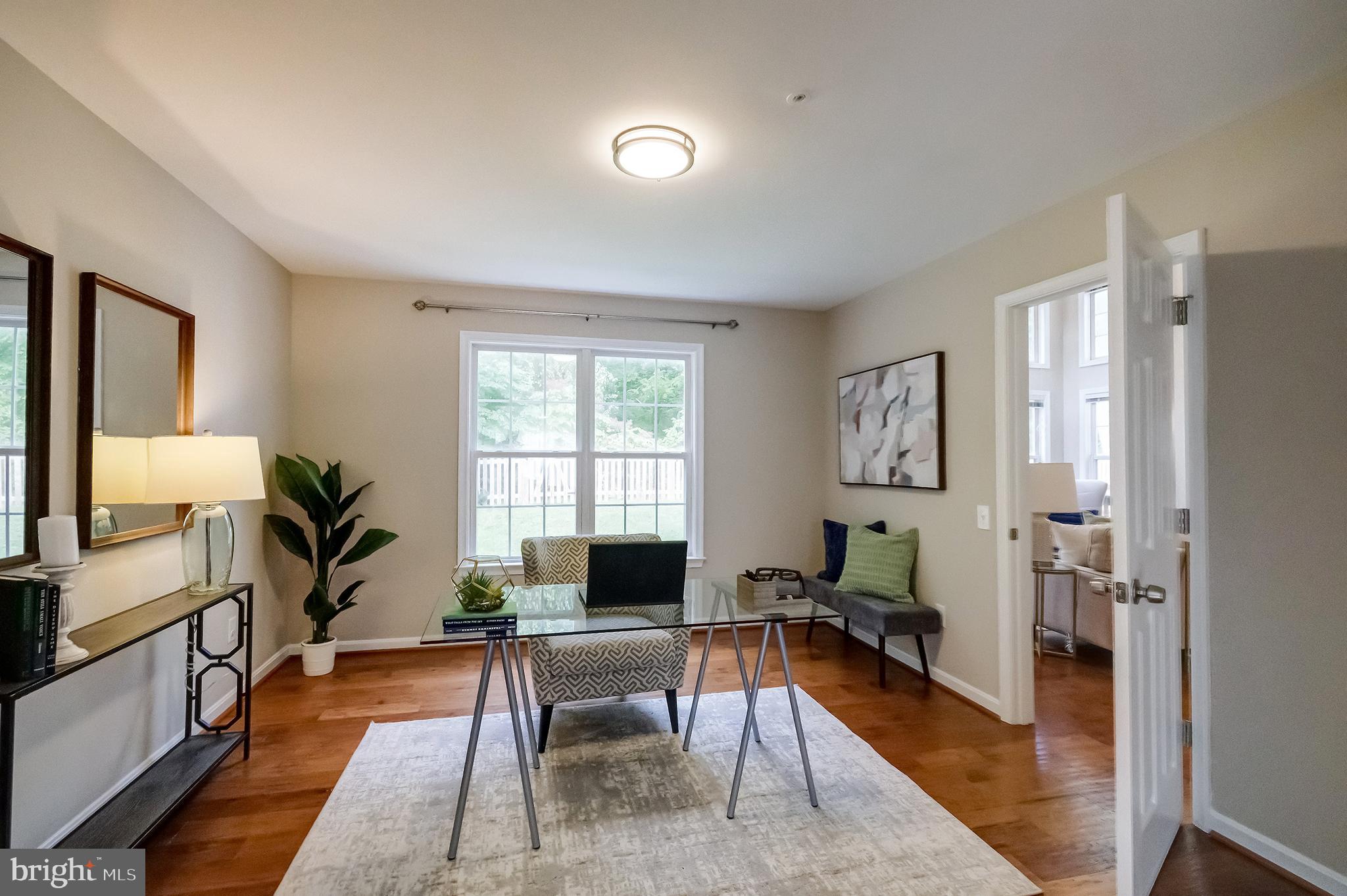7428 Quail Ridge Lane Bowie, MD 20720 - Photo 12 of 87 a living room with furniture a window and a flat screen tv