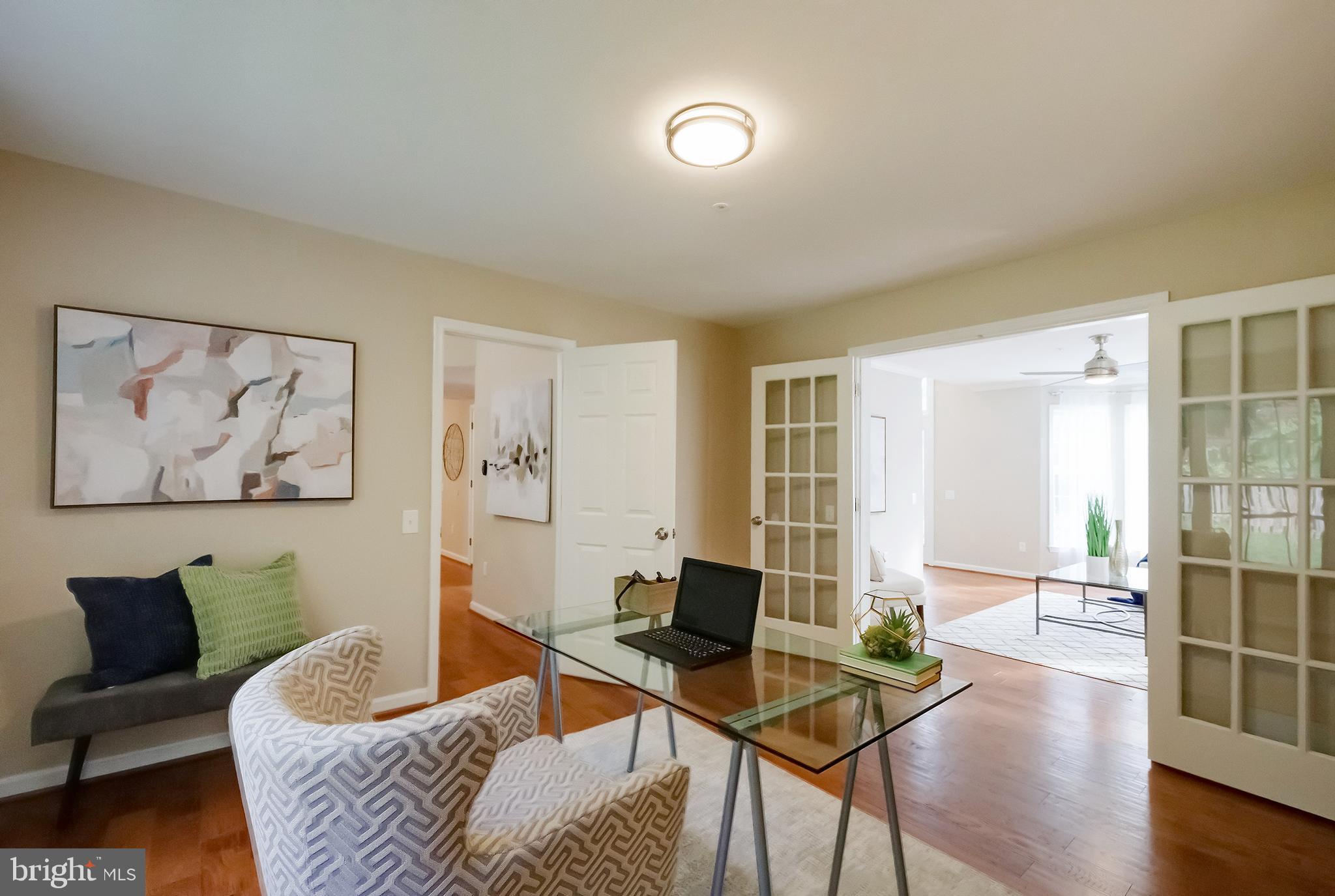 7428 Quail Ridge Lane Bowie, MD 20720 - Photo 13 of 87 a living room with furniture and a large window