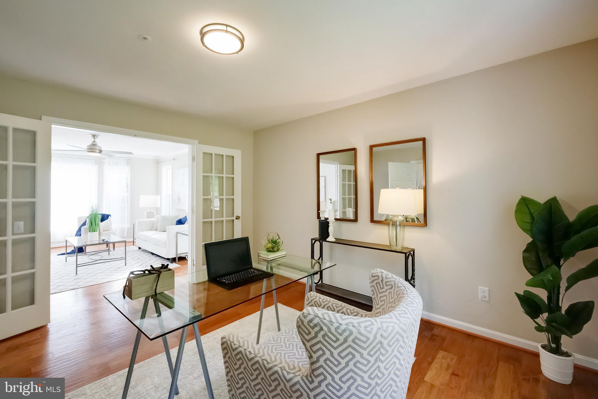7428 Quail Ridge Lane Bowie, MD 20720 - Photo 14 of 87 a living room with furniture and wooden floor