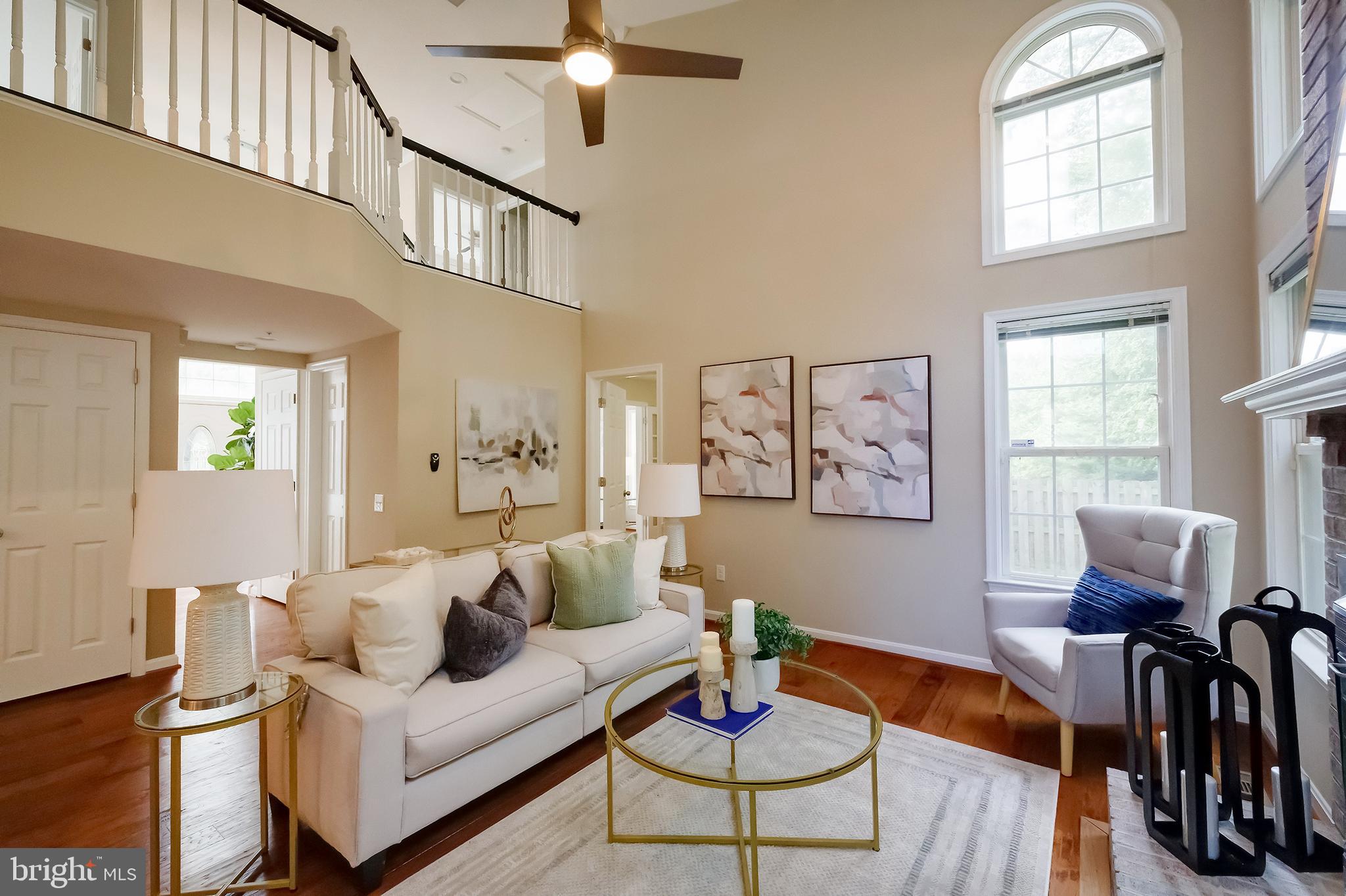 7428 Quail Ridge Lane Bowie, MD 20720 - Photo 17 of 87 a living room with furniture and wooden floor