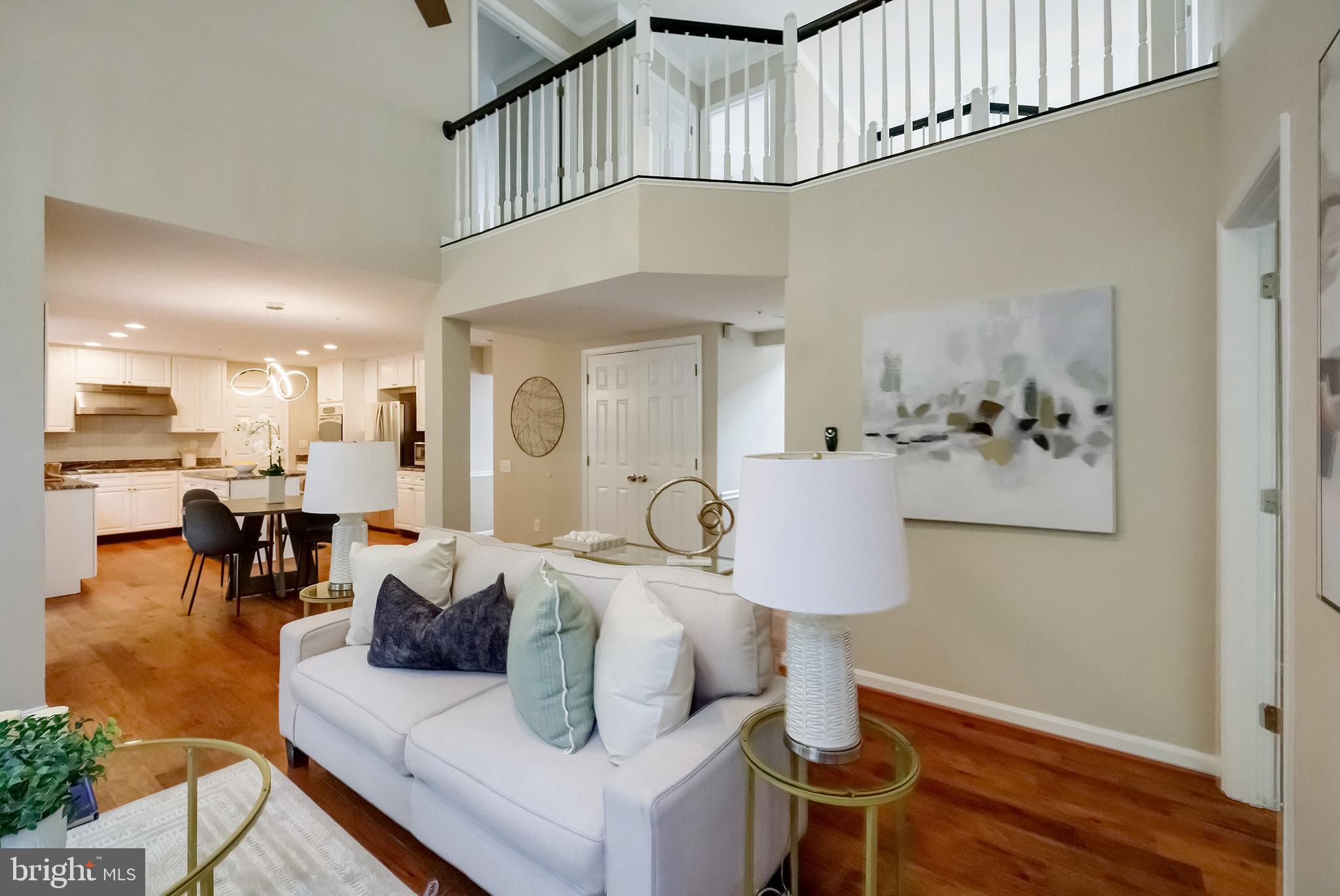7428 Quail Ridge Lane Bowie, MD 20720 - Photo 18 of 87 a living room with furniture and wooden floor