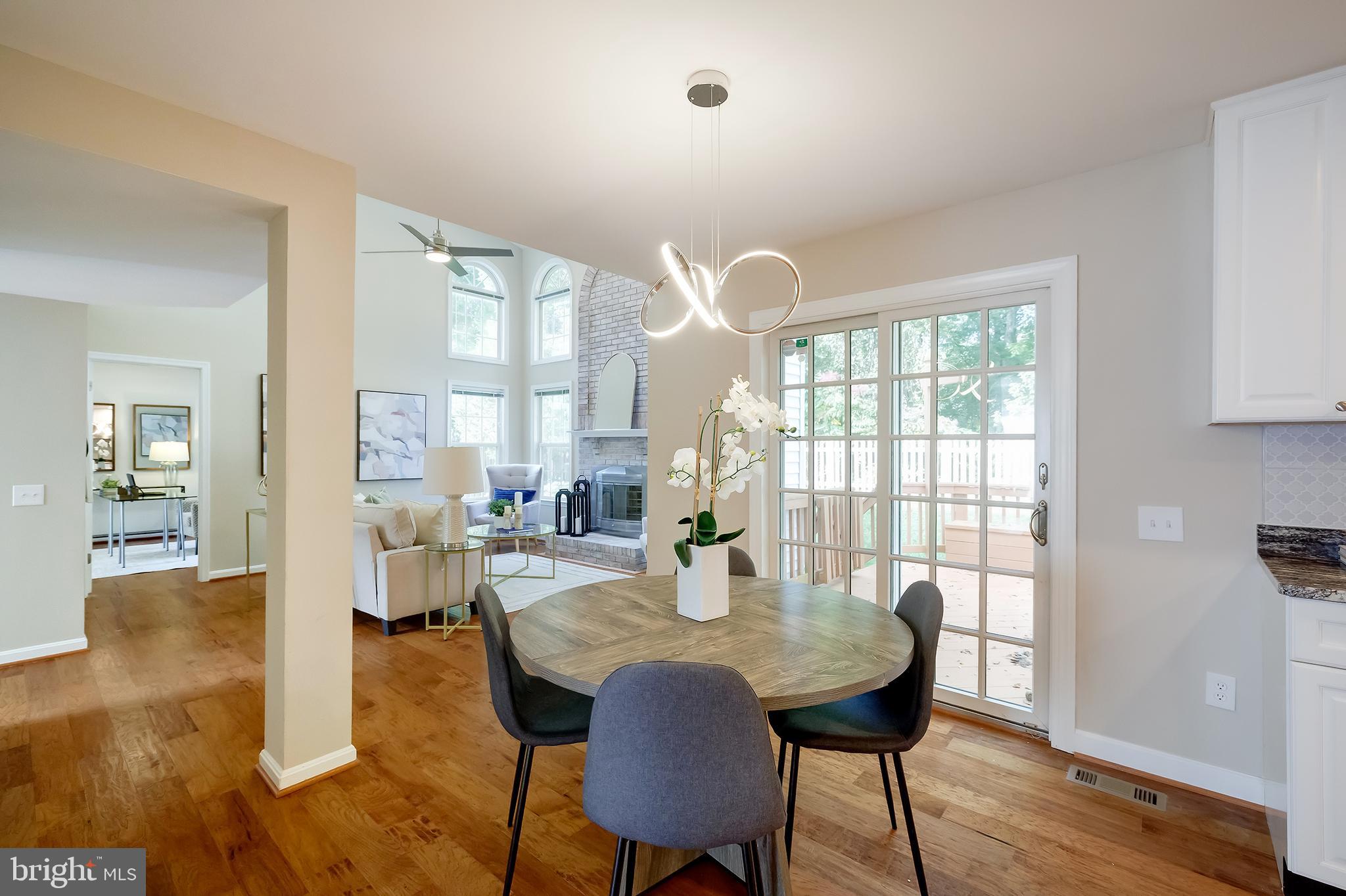 7428 Quail Ridge Lane Bowie, MD 20720 - Photo 19 of 87 a view of a dining room with furniture and wooden floor