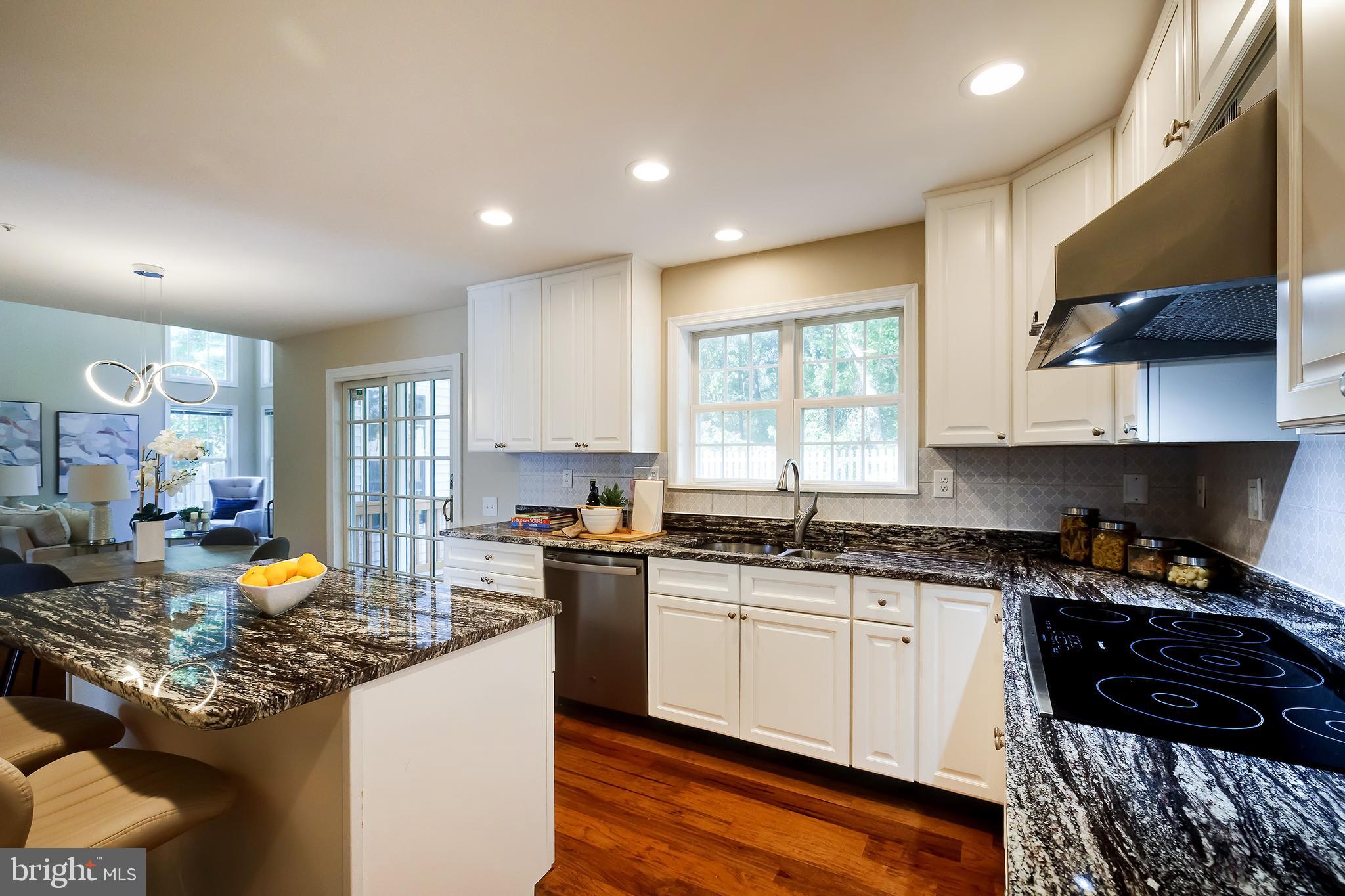 7428 Quail Ridge Lane Bowie, MD 20720 - Photo 26 of 87 a kitchen that has a sink and a stove in it