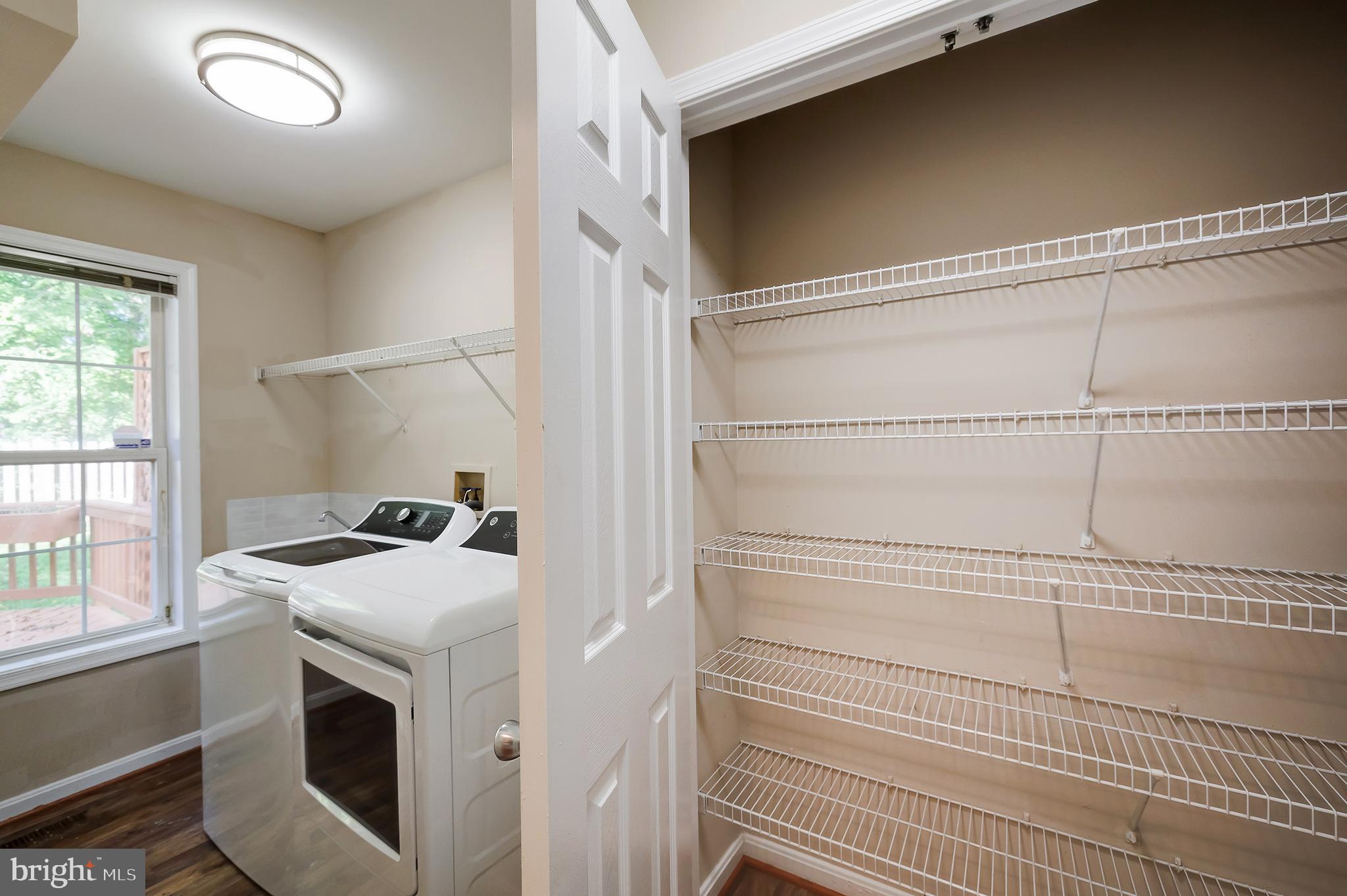7428 Quail Ridge Lane Bowie, MD 20720 - Photo 32 of 87 a utility room with dryer and washer