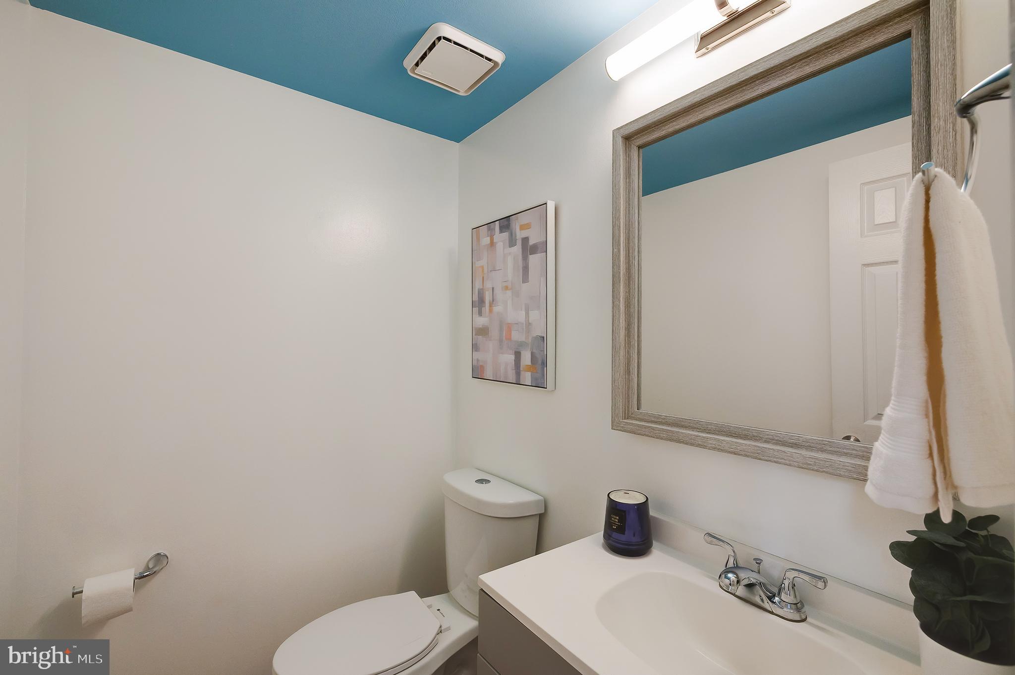 7428 Quail Ridge Lane Bowie, MD 20720 - Photo 34 of 87 a bathroom with a toilet sink and mirror