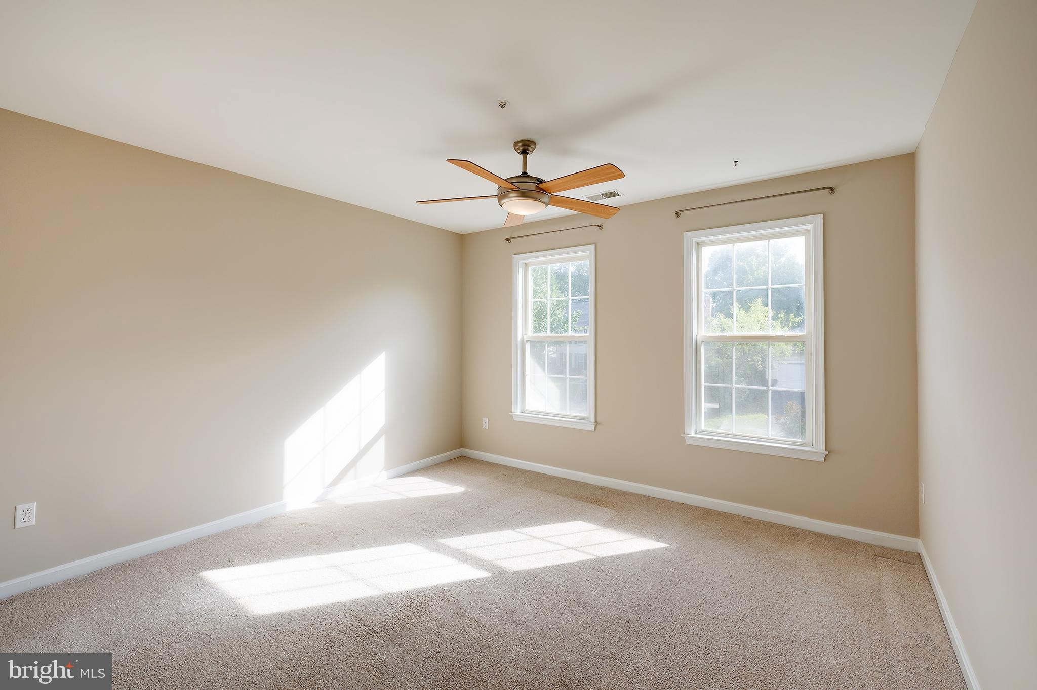 7428 Quail Ridge Lane Bowie, MD 20720 - Photo 36 of 87 an empty room with windows and fan