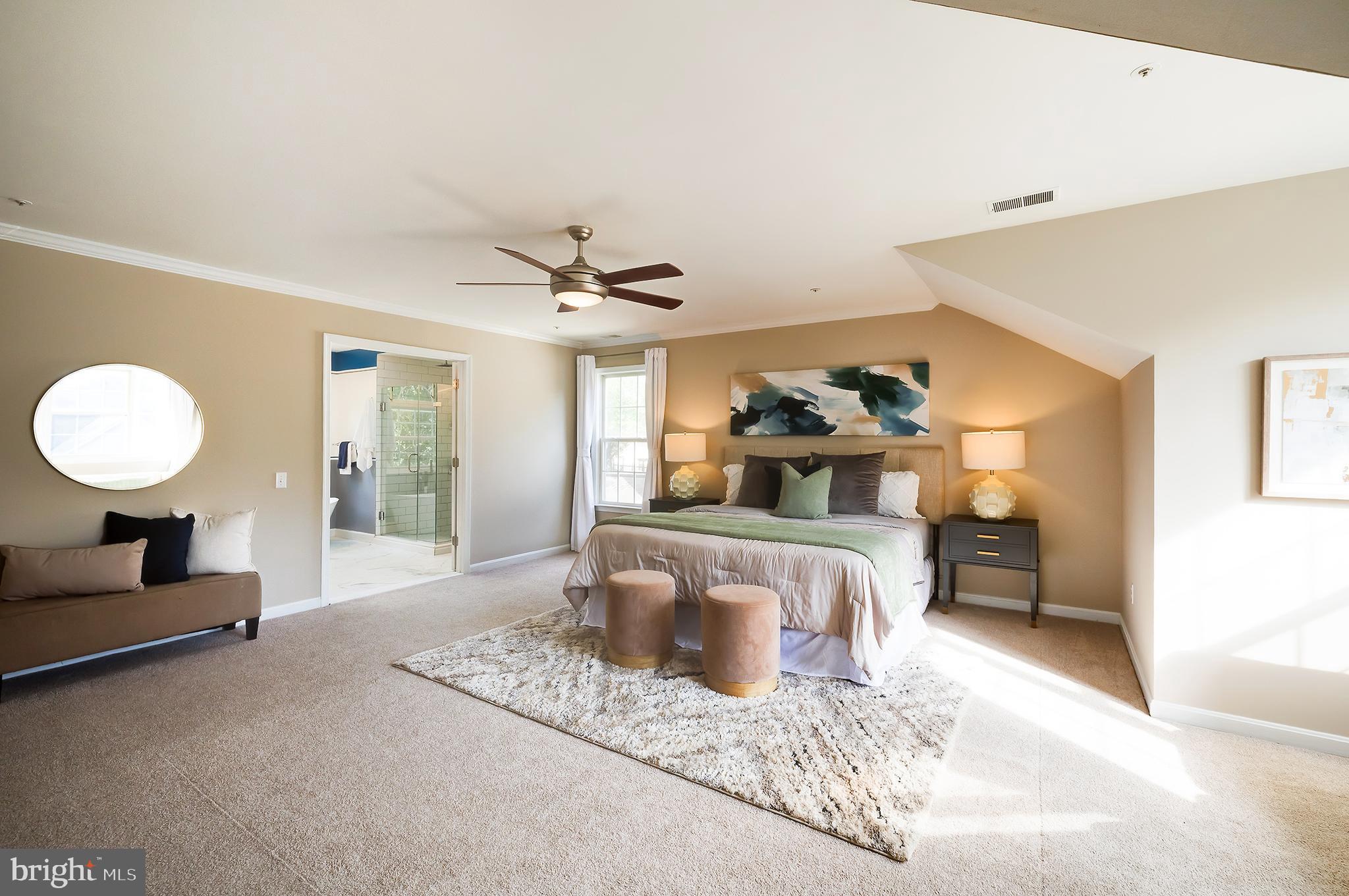 7428 Quail Ridge Lane Bowie, MD 20720 - Photo 50 of 87 a bed room with a bed and a chandelier