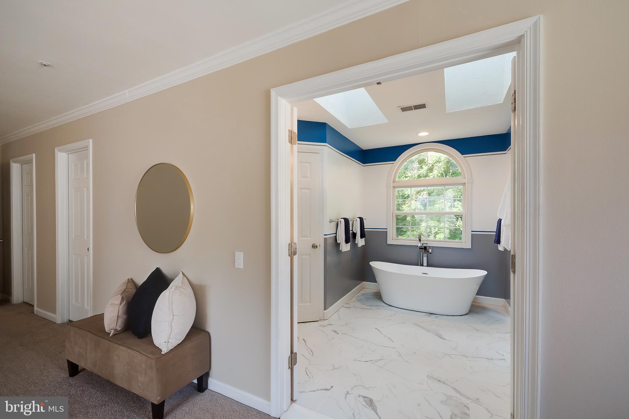 7428 Quail Ridge Lane Bowie, MD 20720 - Photo 52 of 87 a living room with furniture and a large window
