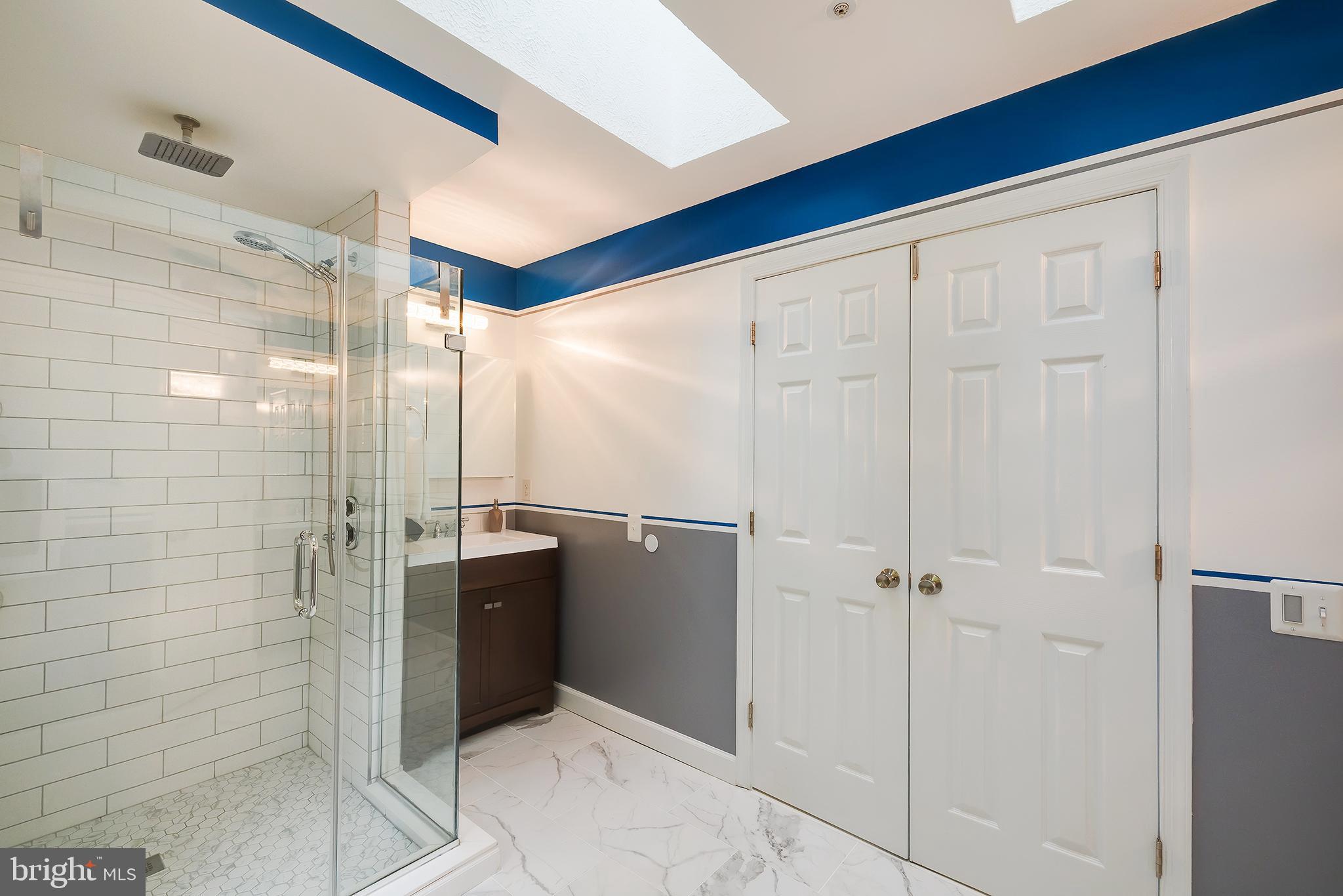 7428 Quail Ridge Lane Bowie, MD 20720 - Photo 57 of 87 a bathroom with a shower and a glass door