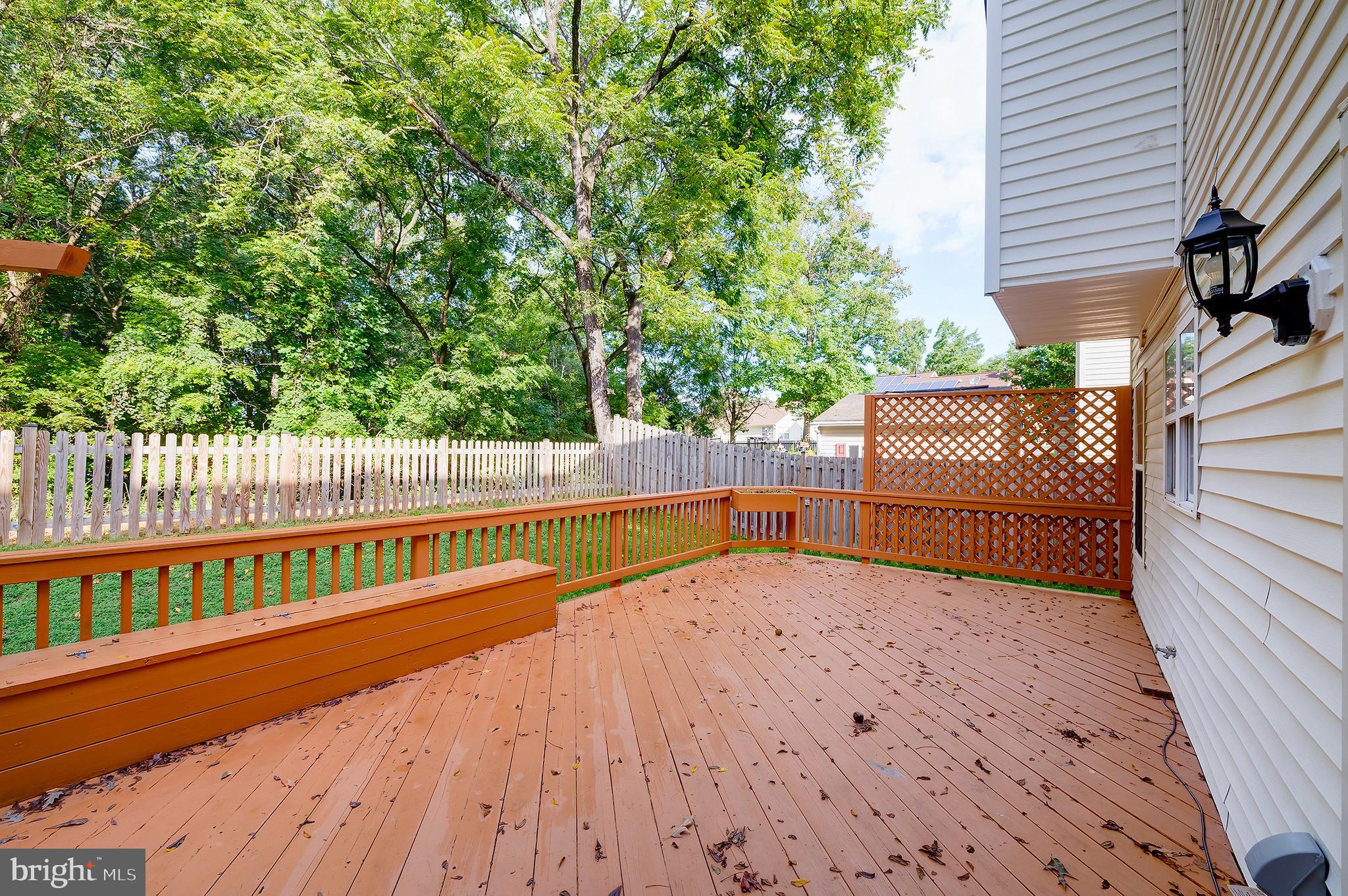 7428 Quail Ridge Lane Bowie, MD 20720 - Photo 81 of 87 a view of a balcony with wooden floor and fence