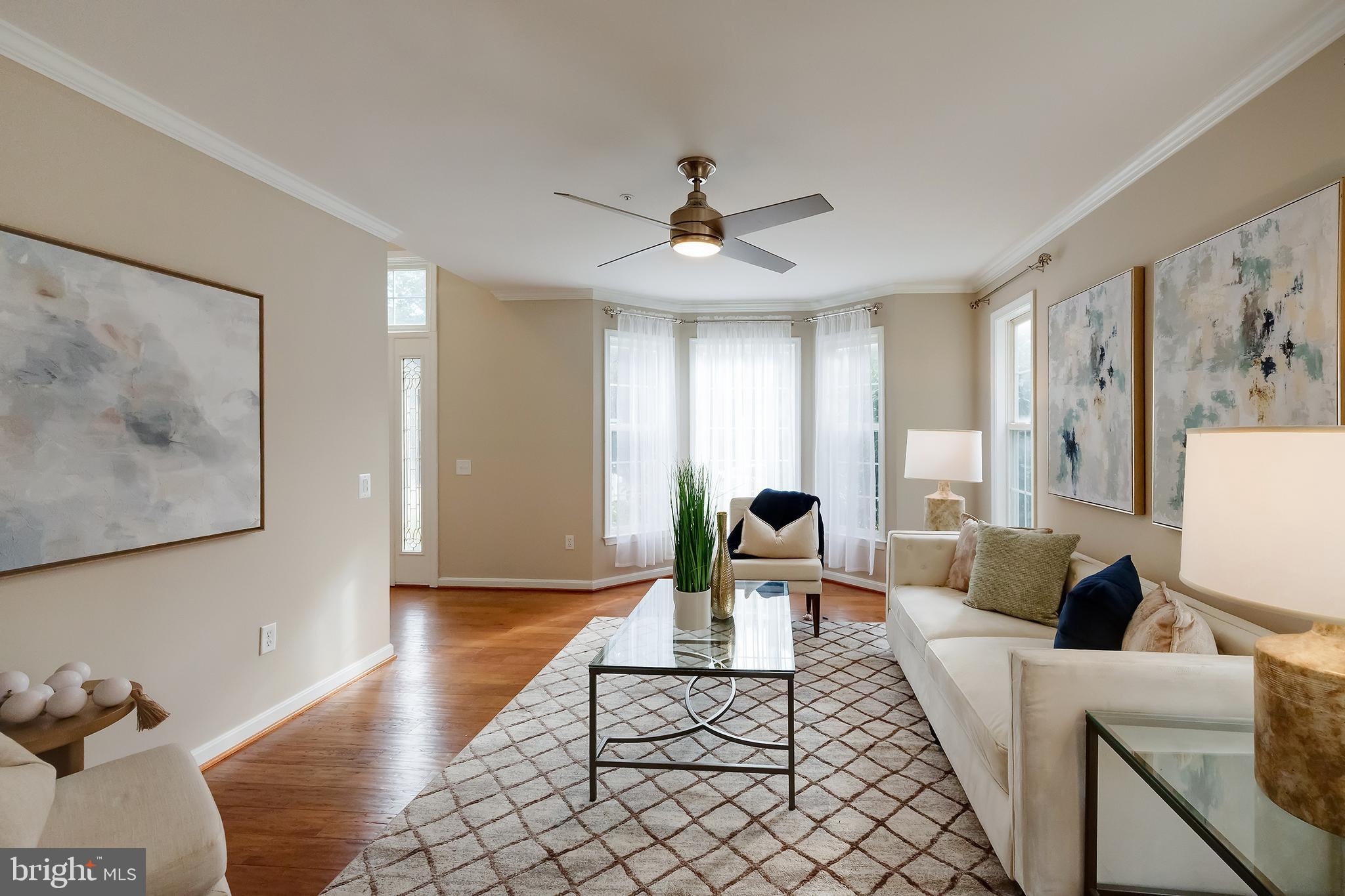7428 Quail Ridge Lane Bowie, MD 20720 - Photo 9 of 87 a living room with furniture and wooden floor