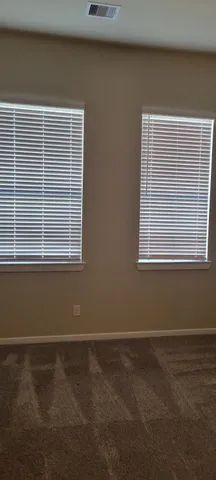 a view of empty room with windows