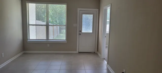 a view of a room that has a window in it