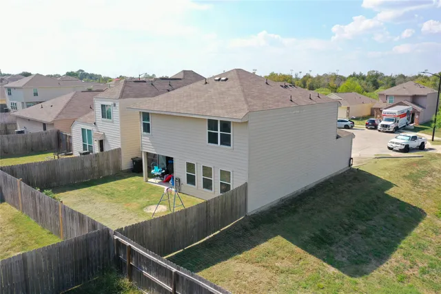 an aerial view of a house having patio