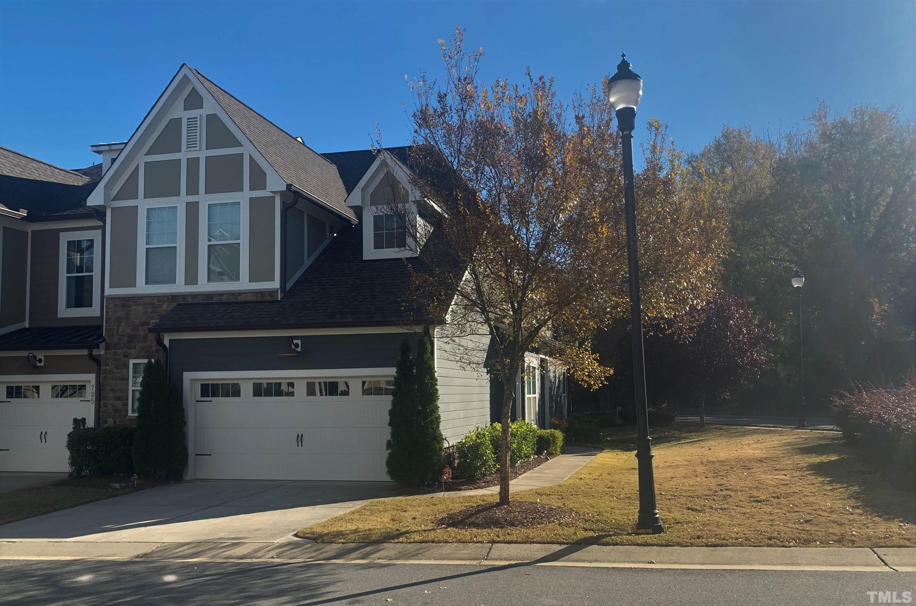 789 Fallon Grove Way Raleigh, NC 27608 - Photo 2 of 29 a front view of a house with a yard