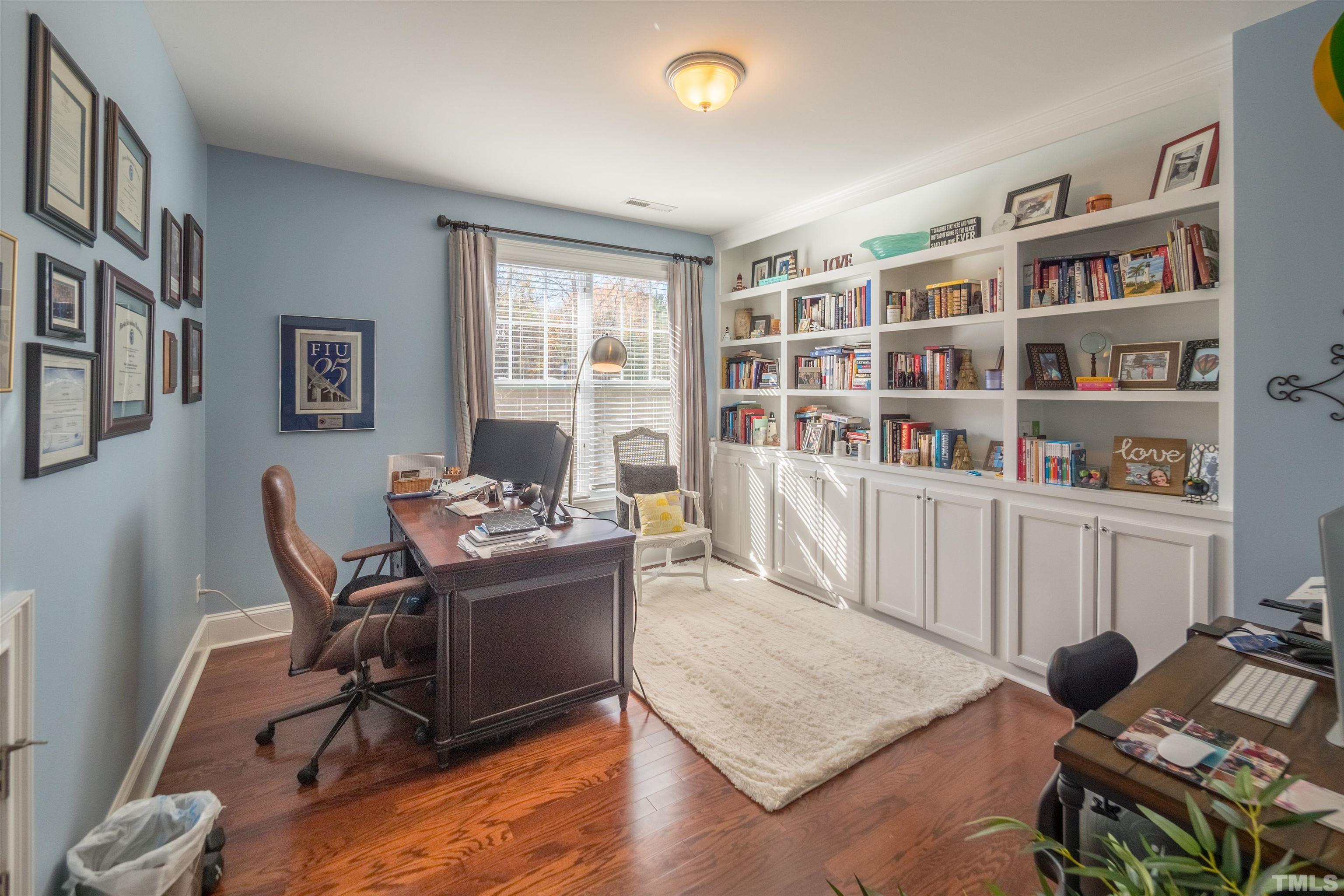 789 Fallon Grove Way Raleigh, NC 27608 - Photo 18 of 29 a living room with furniture and a book shelf