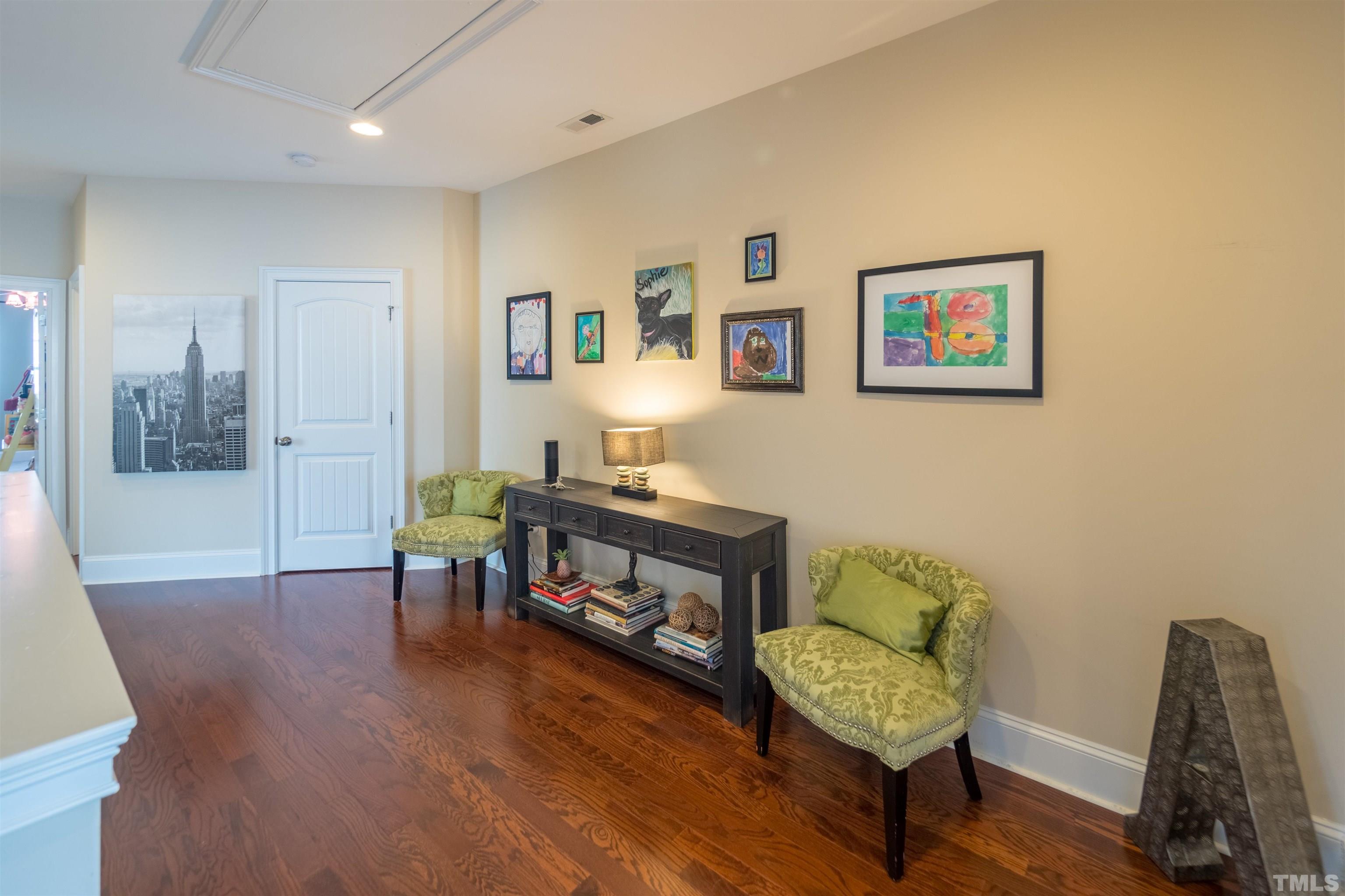789 Fallon Grove Way Raleigh, NC 27608 - Photo 19 of 29 a living room with furniture and a wooden floor