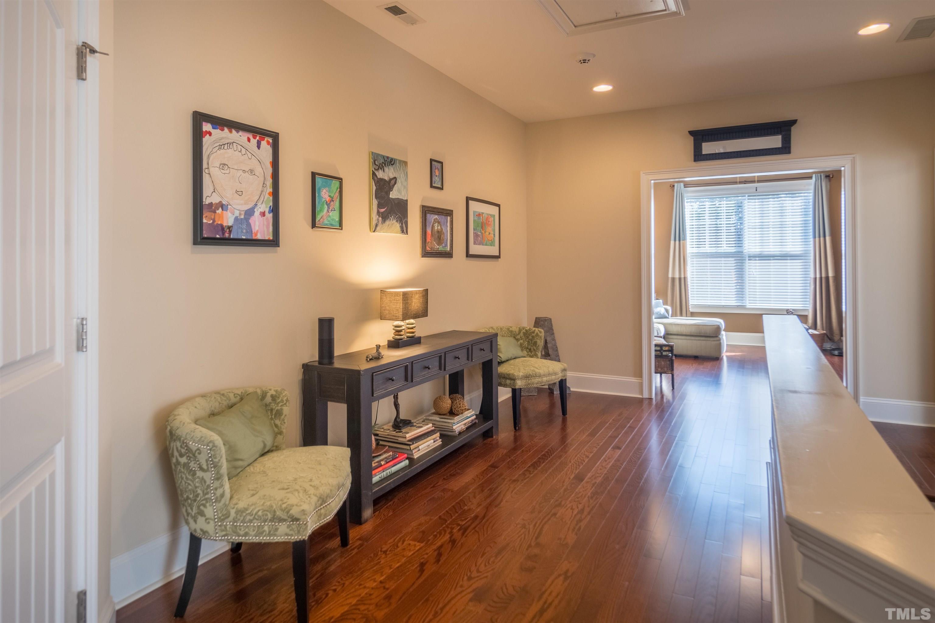 789 Fallon Grove Way Raleigh, NC 27608 - Photo 20 of 29 a living room with furniture and a wooden floor