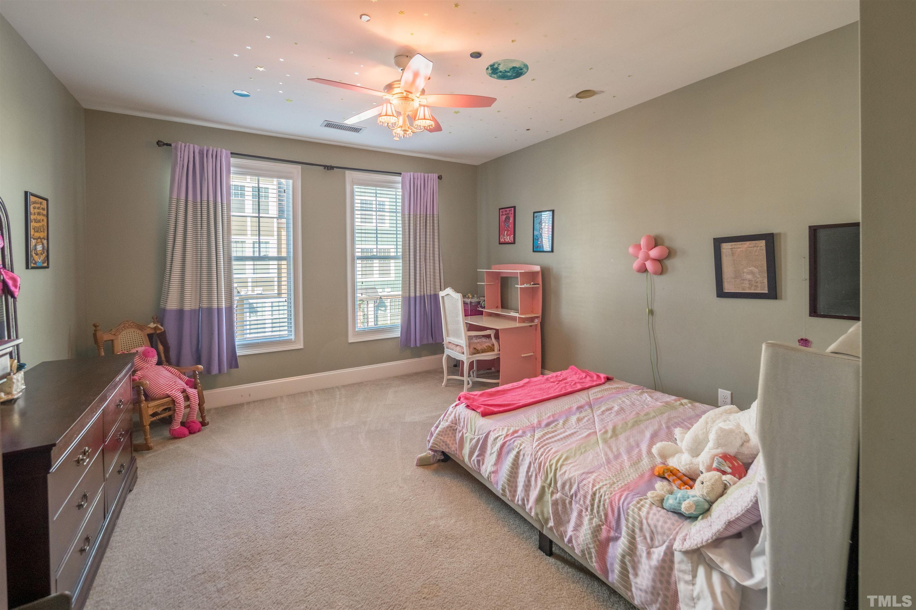 789 Fallon Grove Way Raleigh, NC 27608 - Photo 22 of 29 a bedroom with a bed and a window