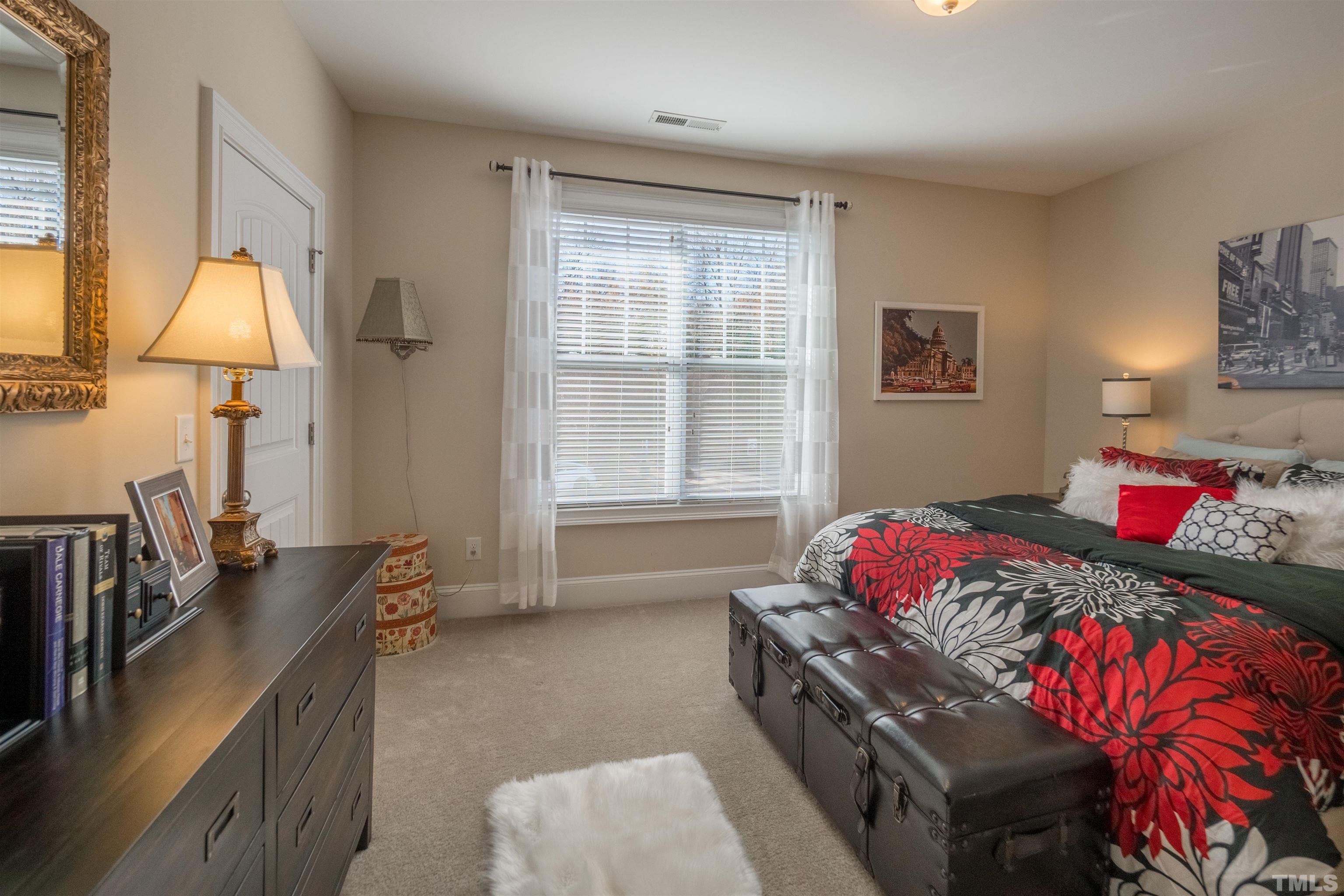 789 Fallon Grove Way Raleigh, NC 27608 - Photo 24 of 29 a bedroom with a bed and a window