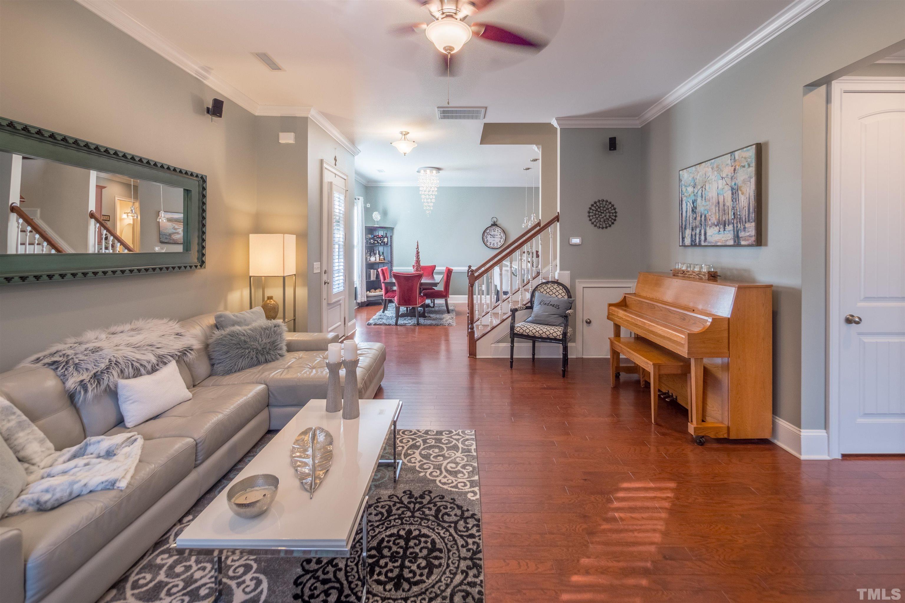 789 Fallon Grove Way Raleigh, NC 27608 - Photo 5 of 29 a living room with furniture and wooden floor