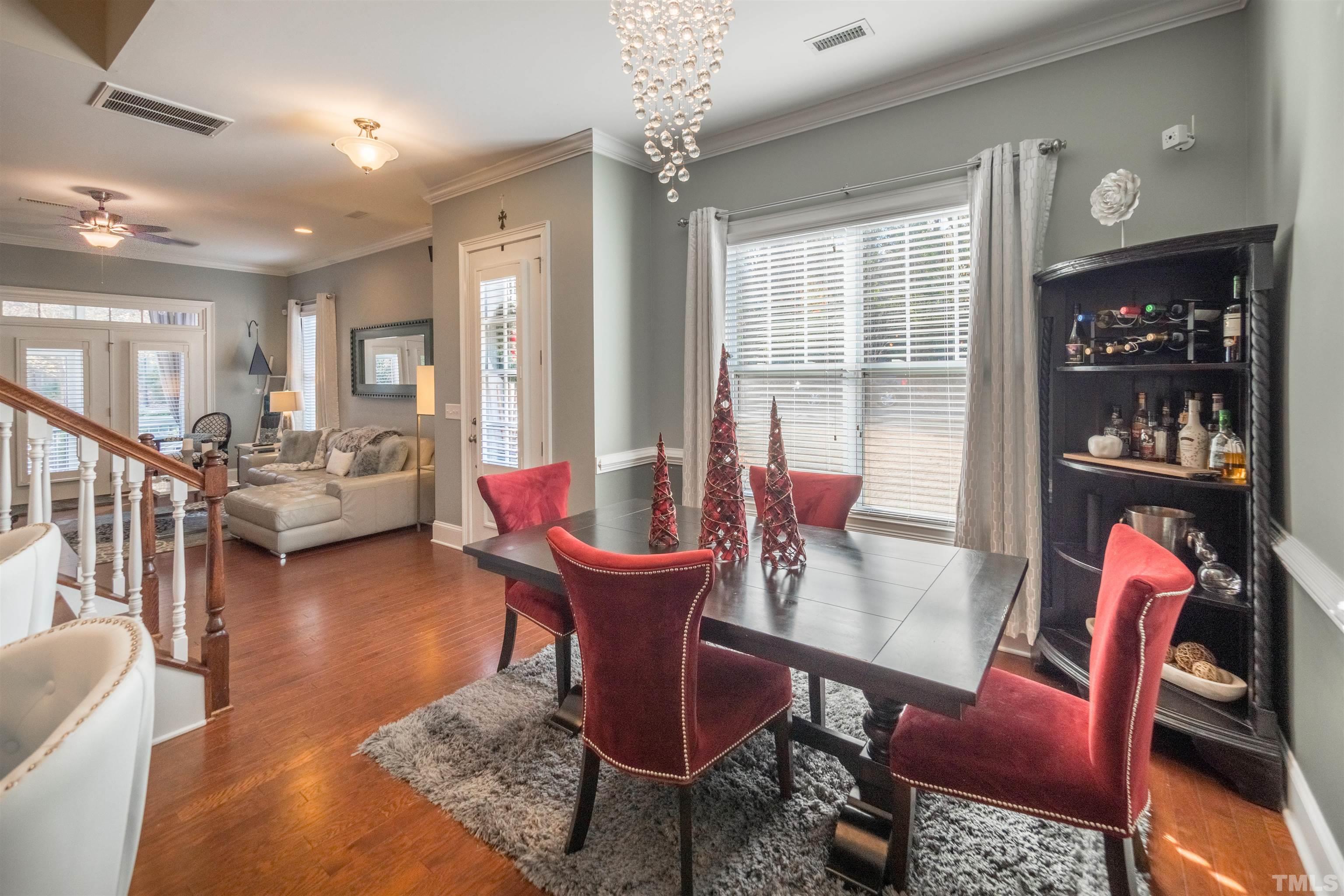789 Fallon Grove Way Raleigh, NC 27608 - Photo 6 of 29 a living room with furniture and a large window