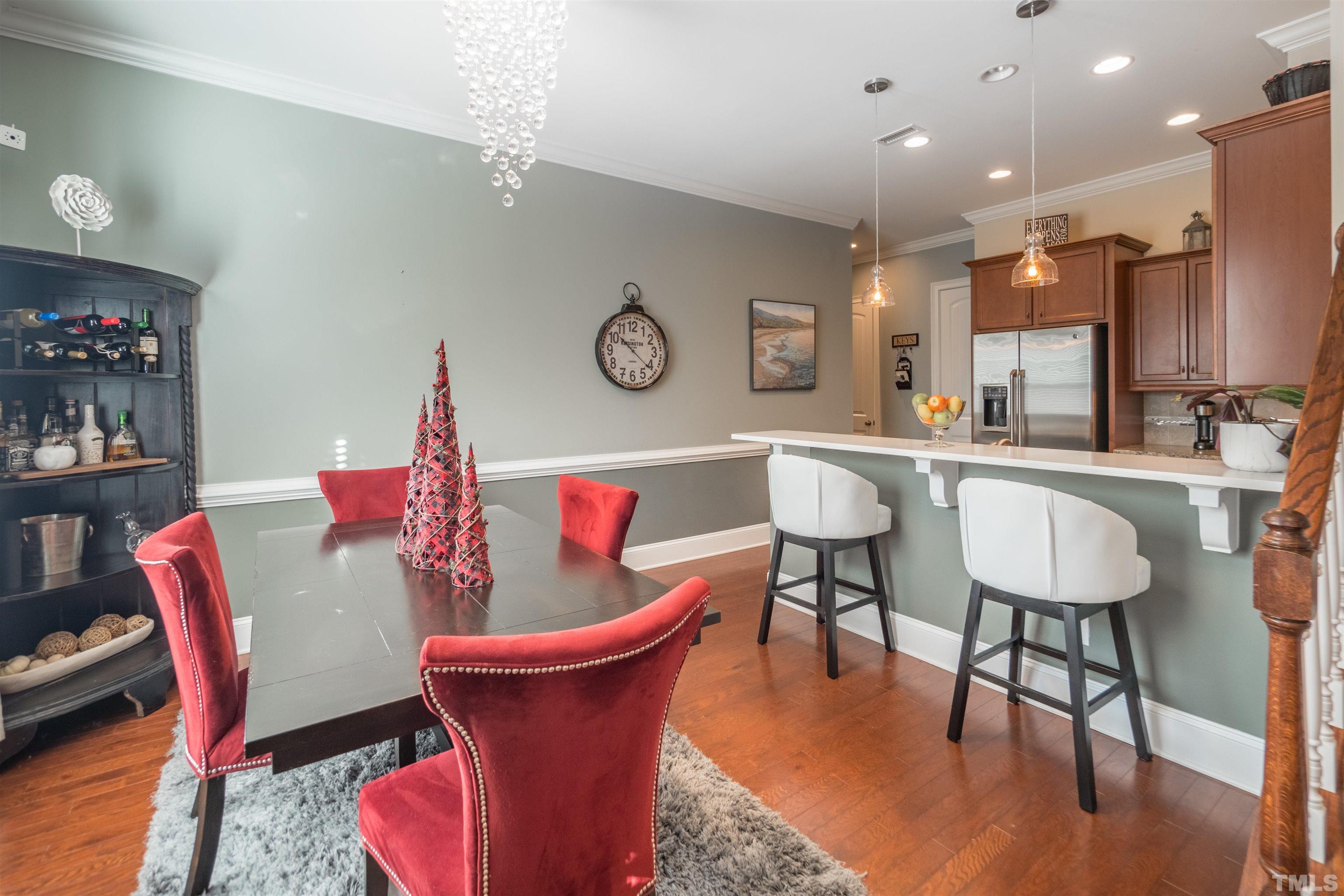 789 Fallon Grove Way Raleigh, NC 27608 - Photo 7 of 29 a view of a dining room with furniture and wooden floor