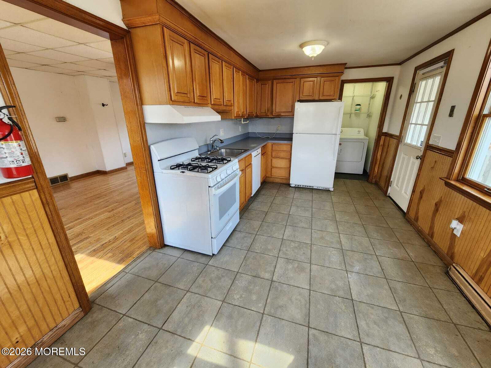 175 Grawtown Road Jackson, NJ 08527 - Photo 15 of 27 a kitchen with a sink a stove top oven a refrigerator and a window
