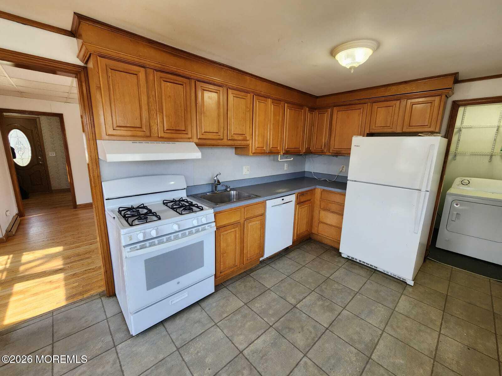 175 Grawtown Road Jackson, NJ 08527 - Photo 16 of 27 a kitchen with a stove a refrigerator and cabinets