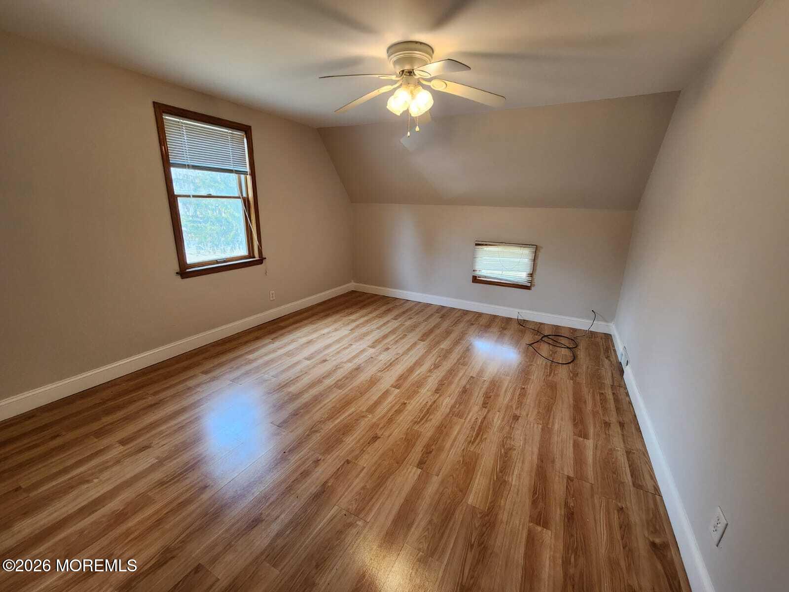 175 Grawtown Road Jackson, NJ 08527 - Photo 22 of 27 wooden floor in an empty room with a window