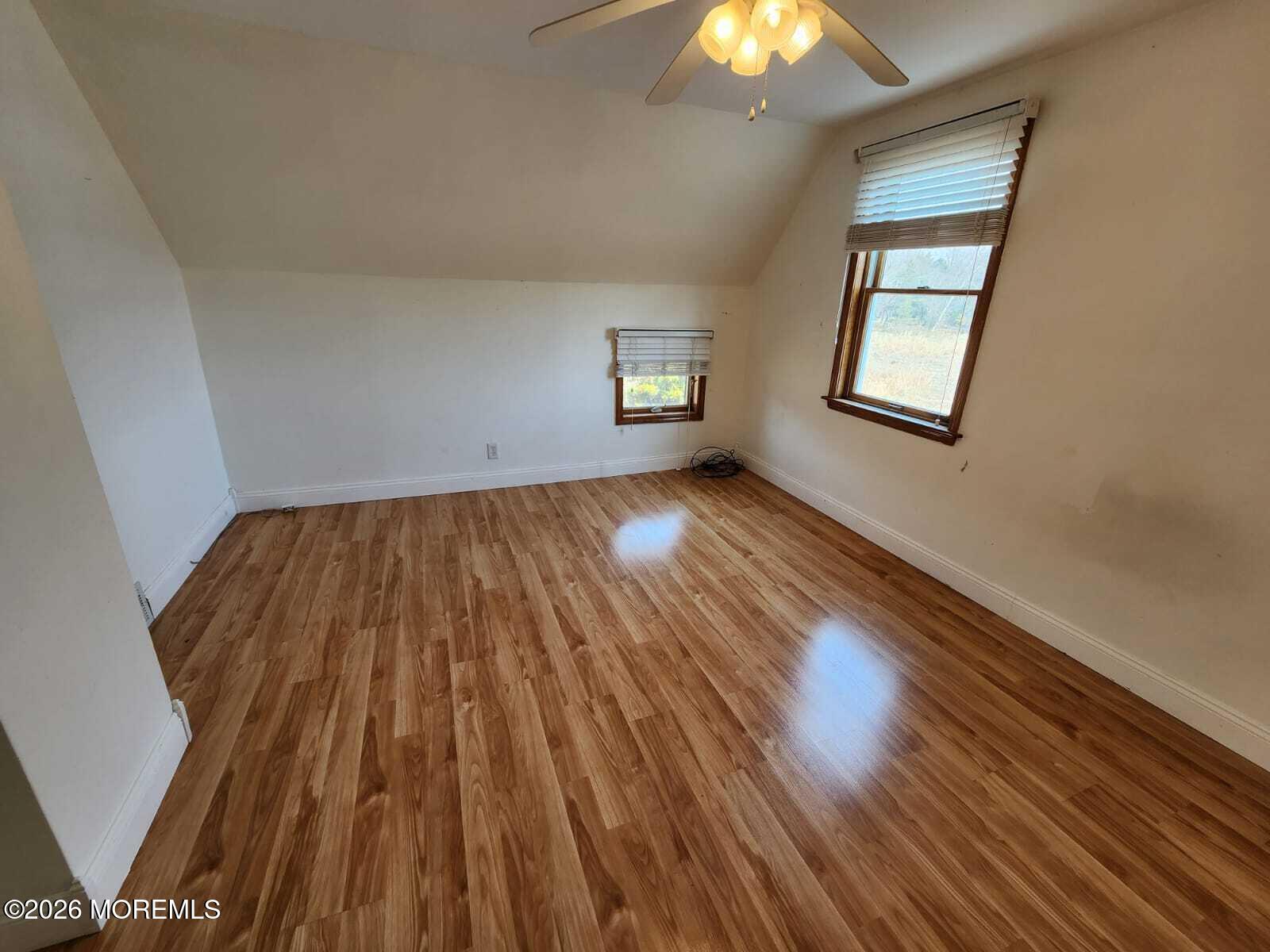 175 Grawtown Road Jackson, NJ 08527 - Photo 24 of 27 wooden floor in an empty room with a window