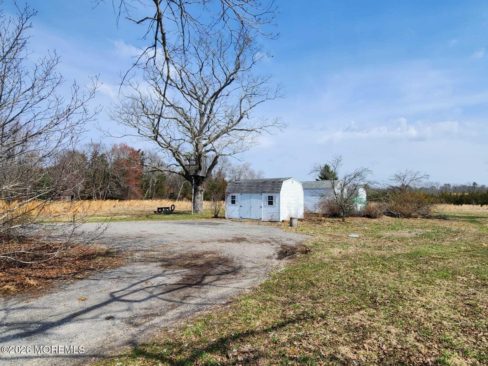 175 Grawtown Road Jackson, NJ 08527 - Photo 8 of 27 a view of dirt yard with green space