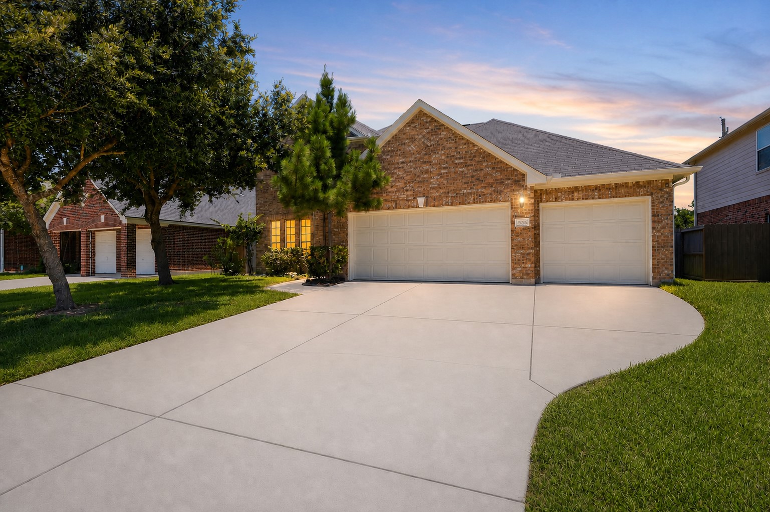 Welcome home to this beautiful two-story brick residence featuring an oversized driveway, mature shade trees, professionally maintained landscaping, and exceptional curb appeal. The inviting exterior offers timeless architecture and a warm first impression from the moment you arrive.  Yes, real three car garage!  No flooding during any of the storms!
