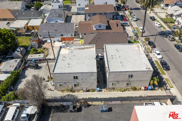 an aerial view of a residential houses with terrace