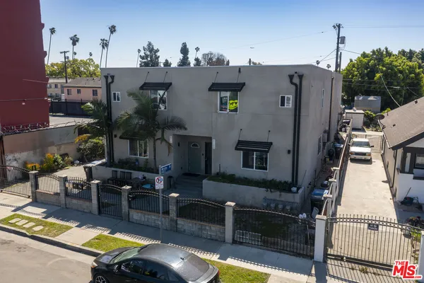 a aerial view of a house with swimming pool