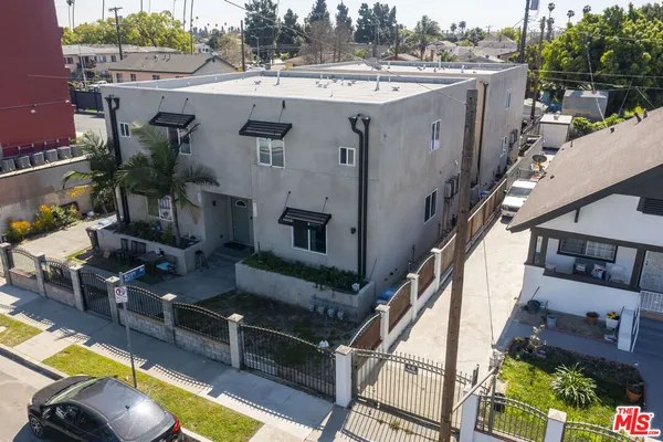 an aerial view of a house with swimming pool
