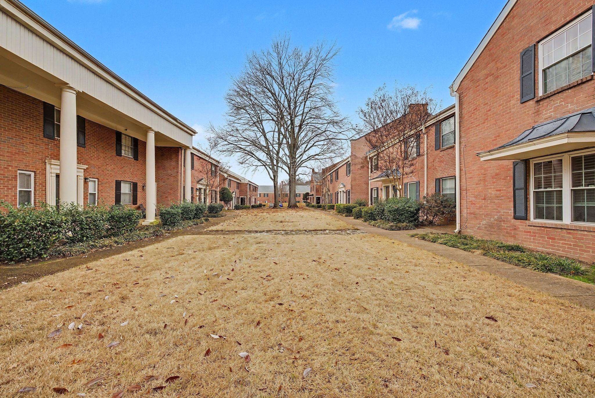 5700 Quince Road, Unit 6 Memphis, TN 38119 - Photo 12 of 15 View of community featuring a yard