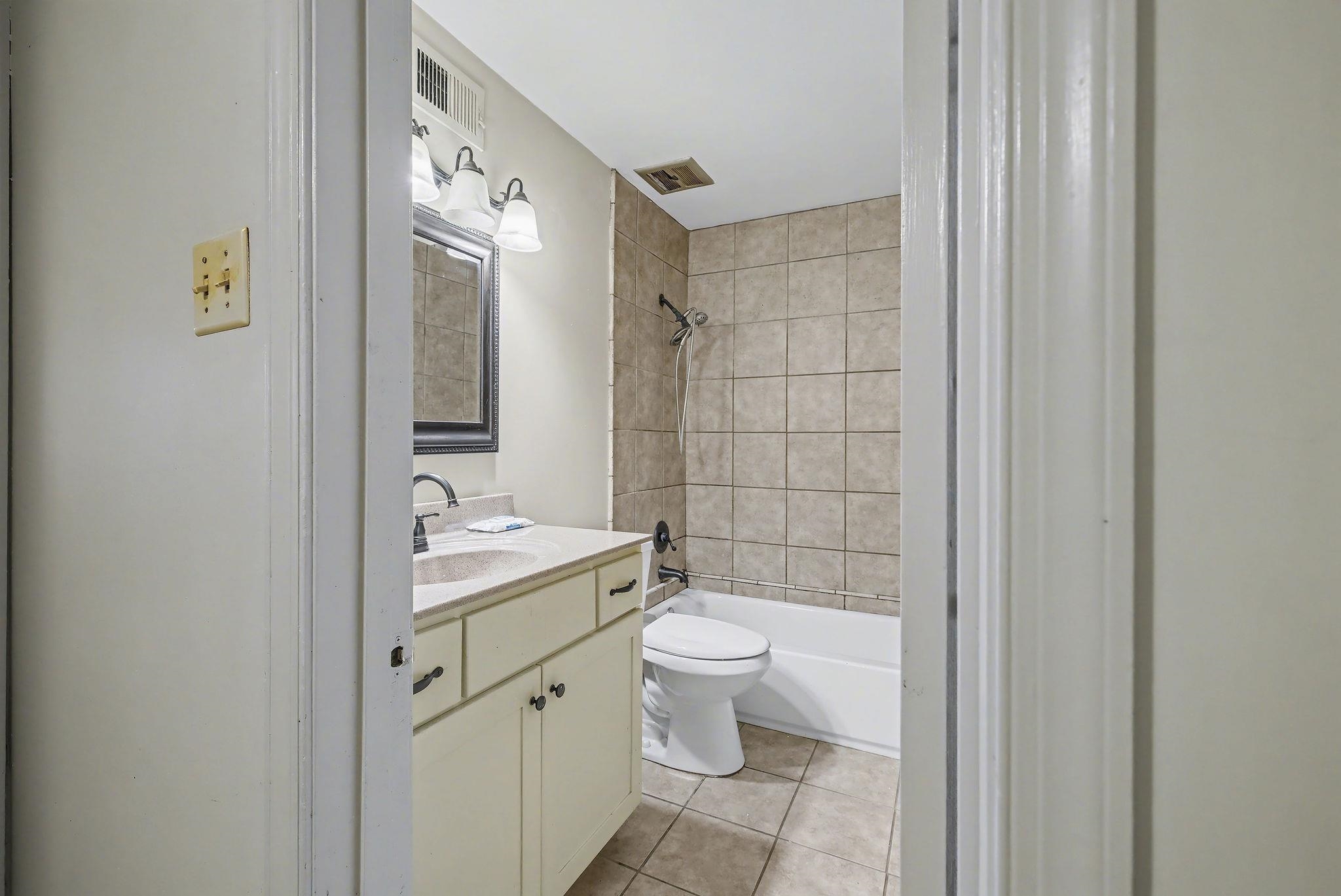 5700 Quince Road, Unit 6 Memphis, TN 38119 - Photo 10 of 15 Full bath featuring vanity, bathing tub / shower combination, and light tile patterned floors