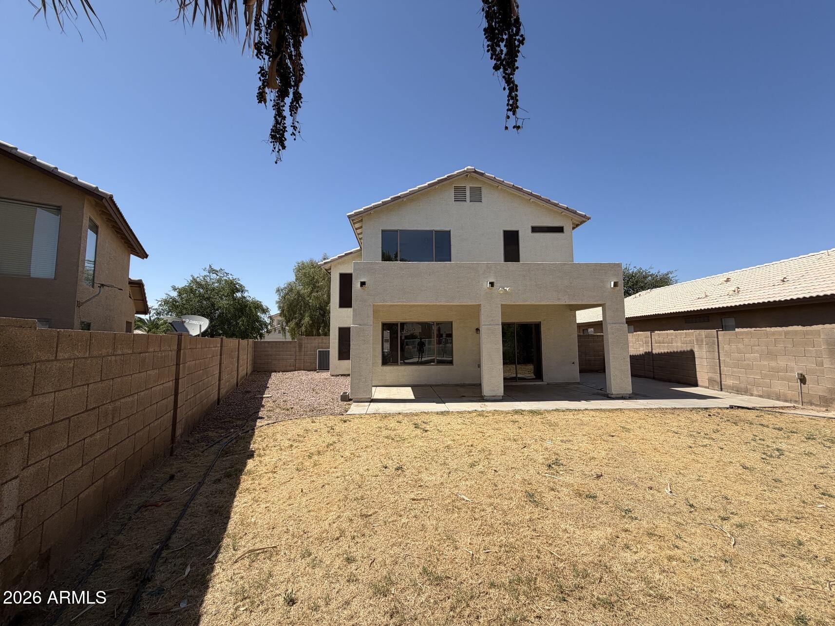 10807 West Monte Vista Road Avondale, AZ 85392 - Photo 6 of 33 a front view of a house with a yard