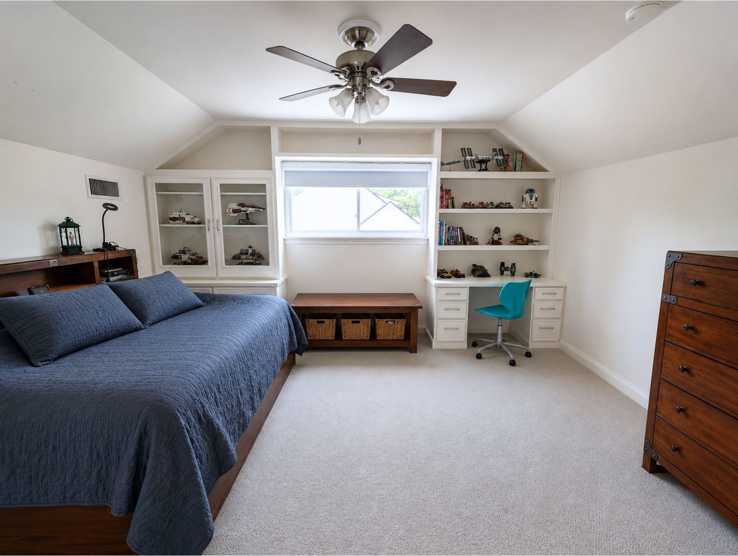13047 Taylorcrest Road Houston, TX 77079 - Photo 20 of 23 Another upstairs secondary bedroom offers generous space, enhanced by custom built-in cabinetry, shelving, & a built-in desk, creating a functional retreat for rest, study, or hobbies.