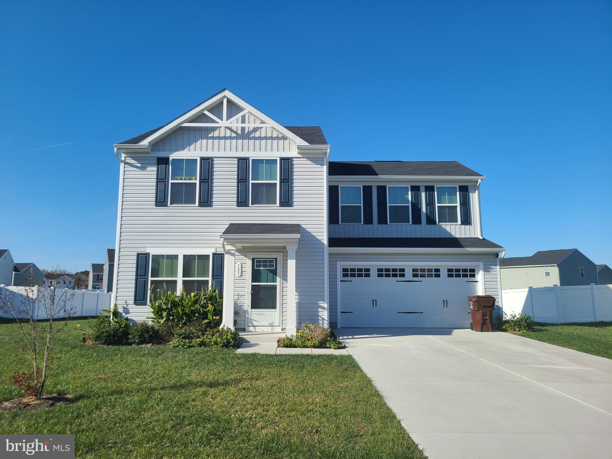 105 Mariners Way Cambridge, MD 21613 - Photo 1 of 45 a front view of a house with a yard