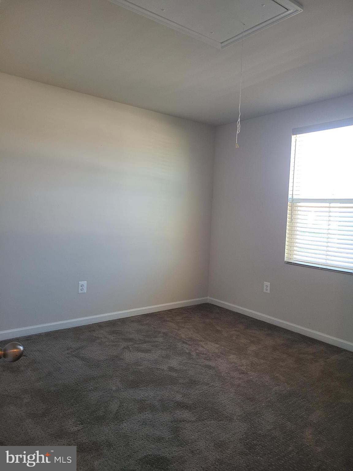 105 Mariners Way Cambridge, MD 21613 - Photo 12 of 45 an empty room with a window