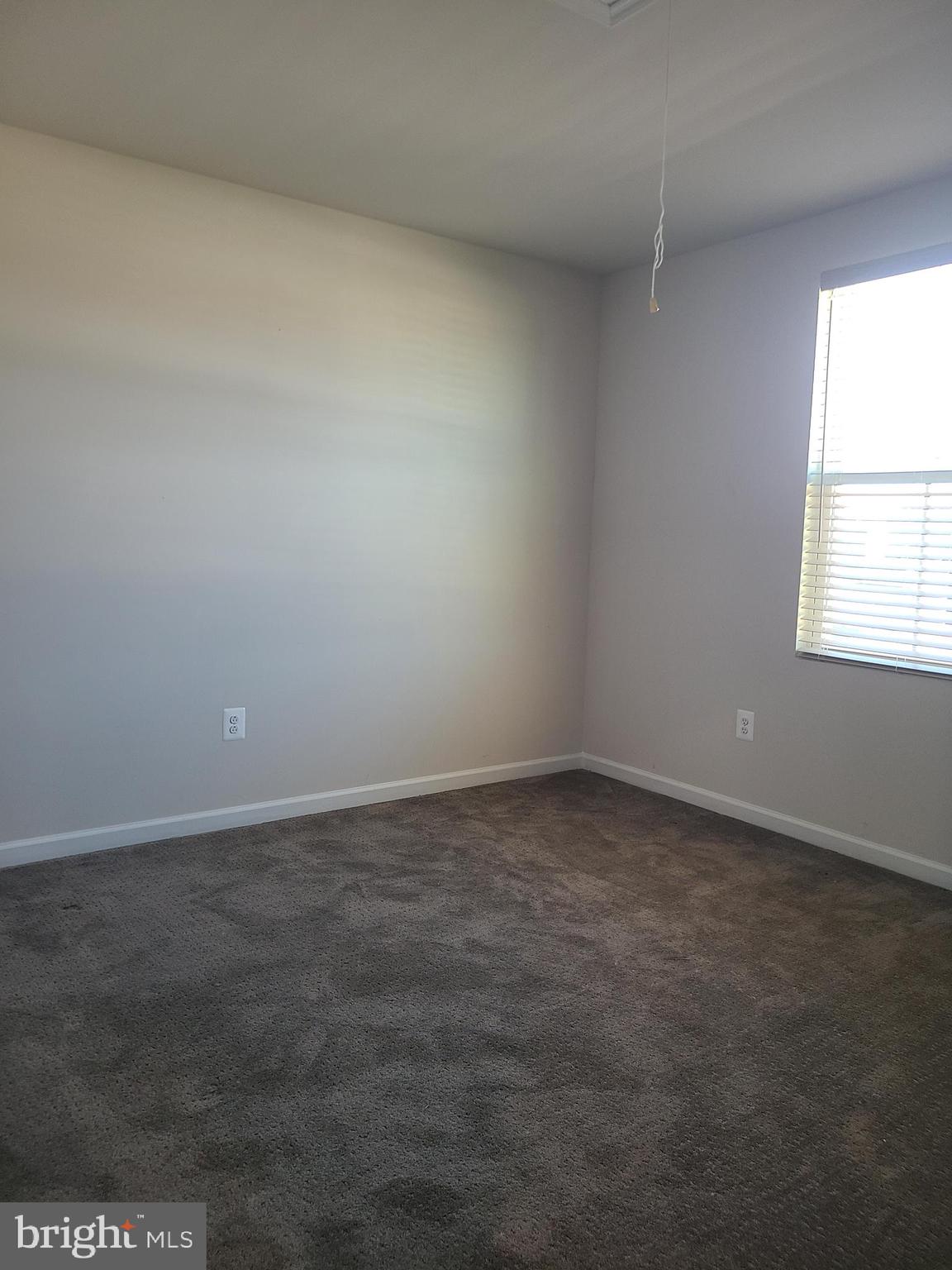 105 Mariners Way Cambridge, MD 21613 - Photo 13 of 45 an empty room with a window