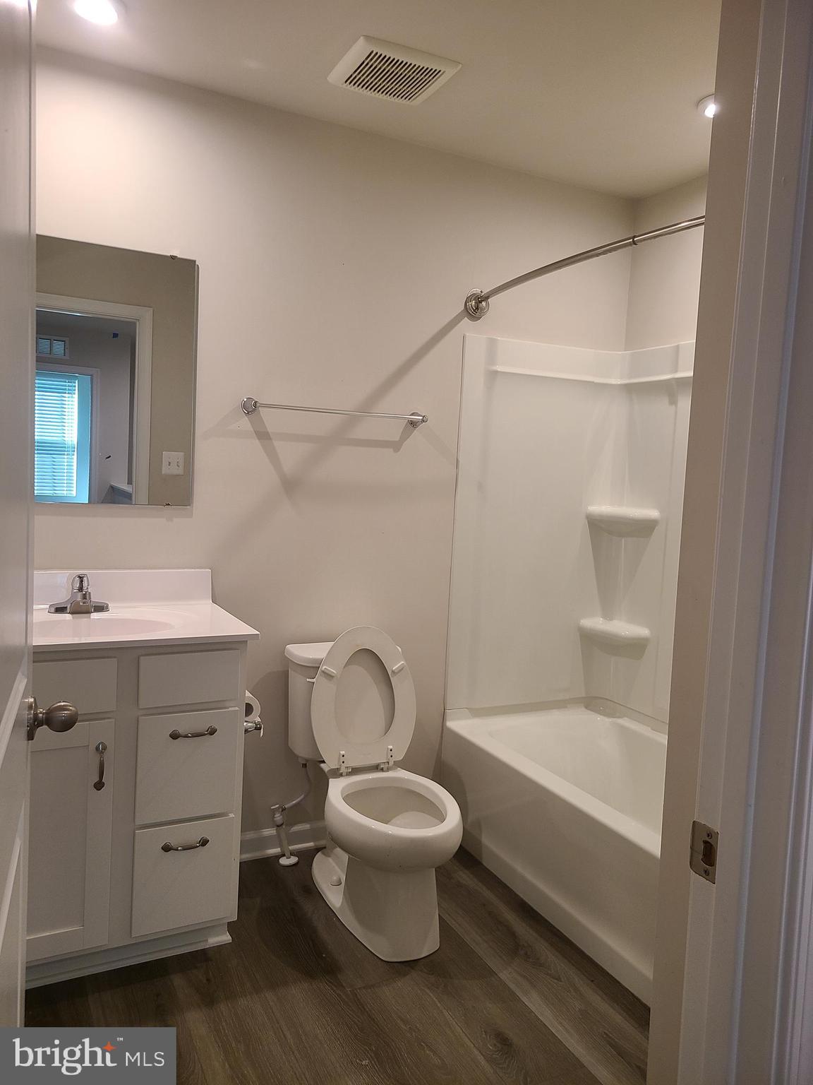 105 Mariners Way Cambridge, MD 21613 - Photo 16 of 45 a bathroom with a toilet a sink and a bathtub