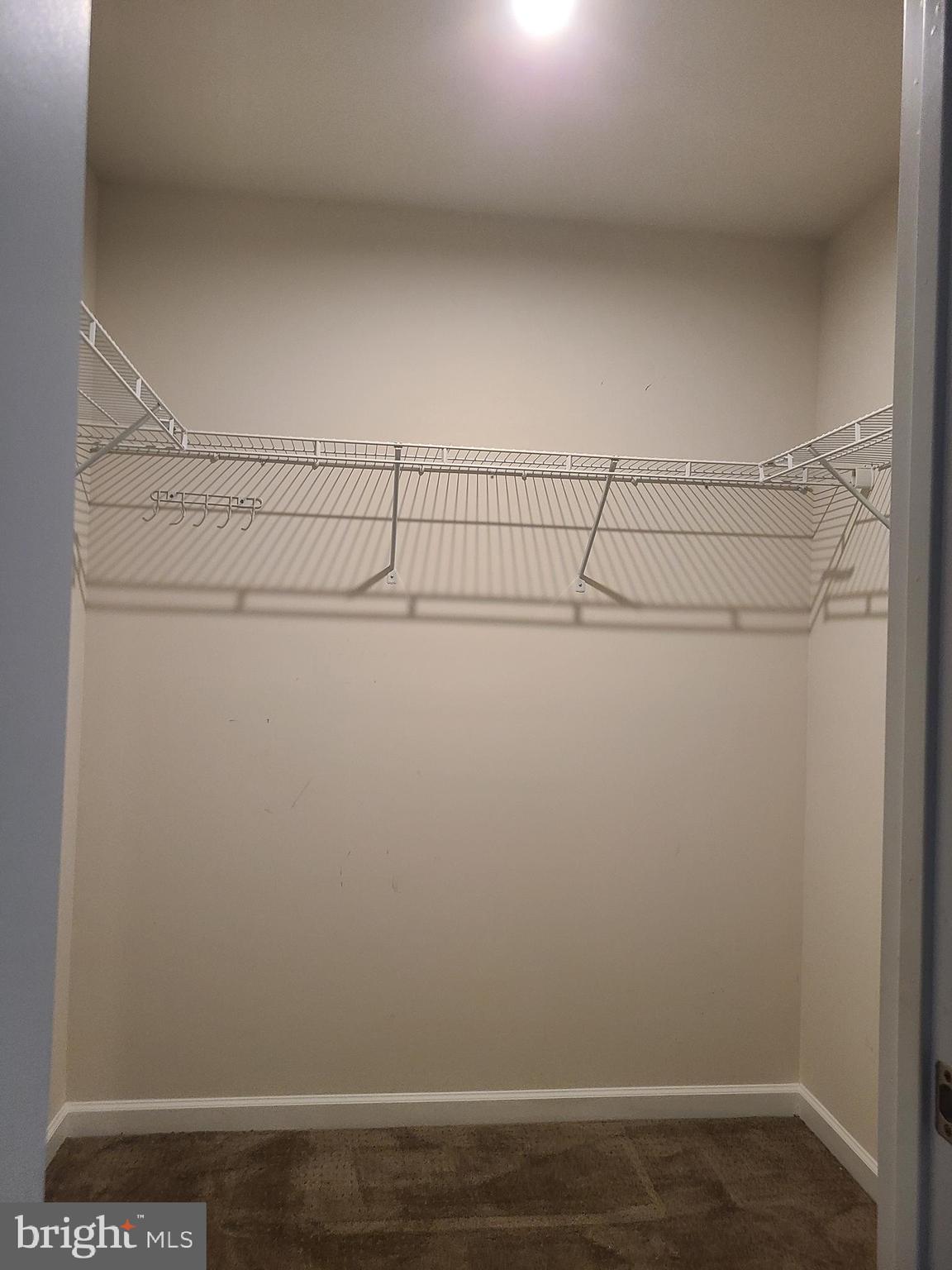 105 Mariners Way Cambridge, MD 21613 - Photo 22 of 45 a view of small space with racks on the wall