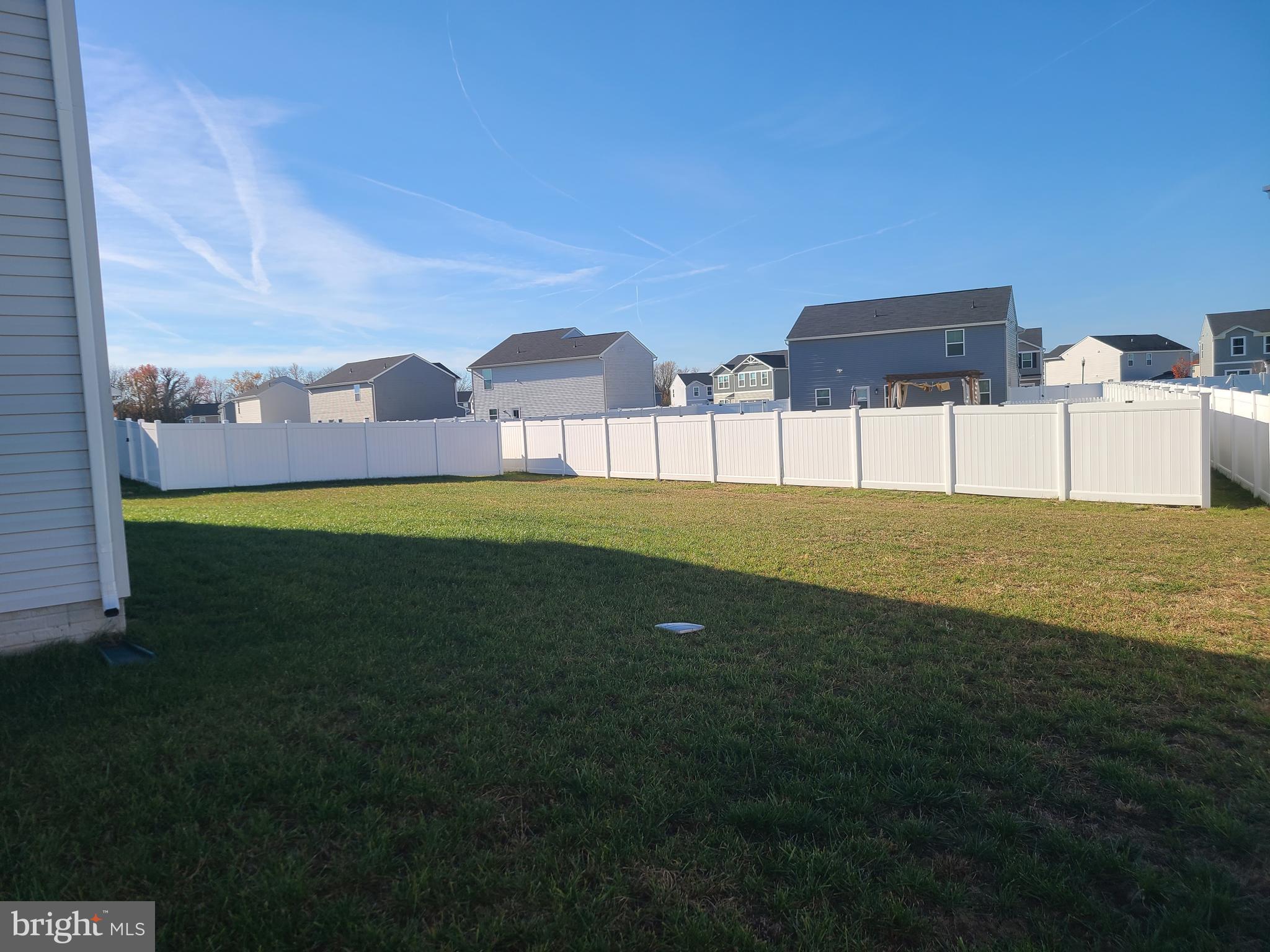 105 Mariners Way Cambridge, MD 21613 - Photo 43 of 45 a view of a big yard with a house